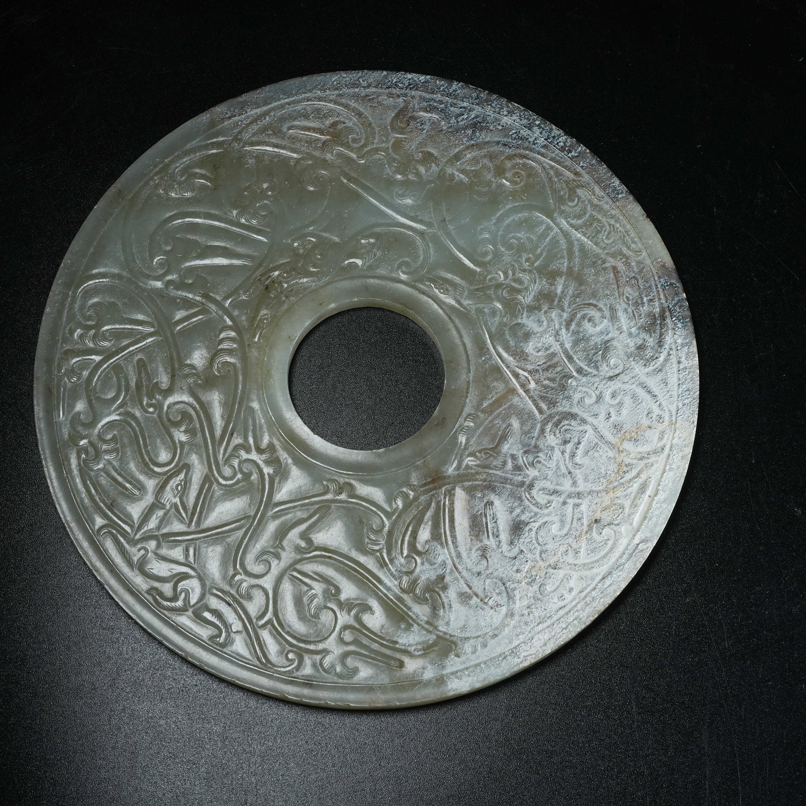 A ARCHAIC JADE BI DISC WITH BEAST PATTERN - 9