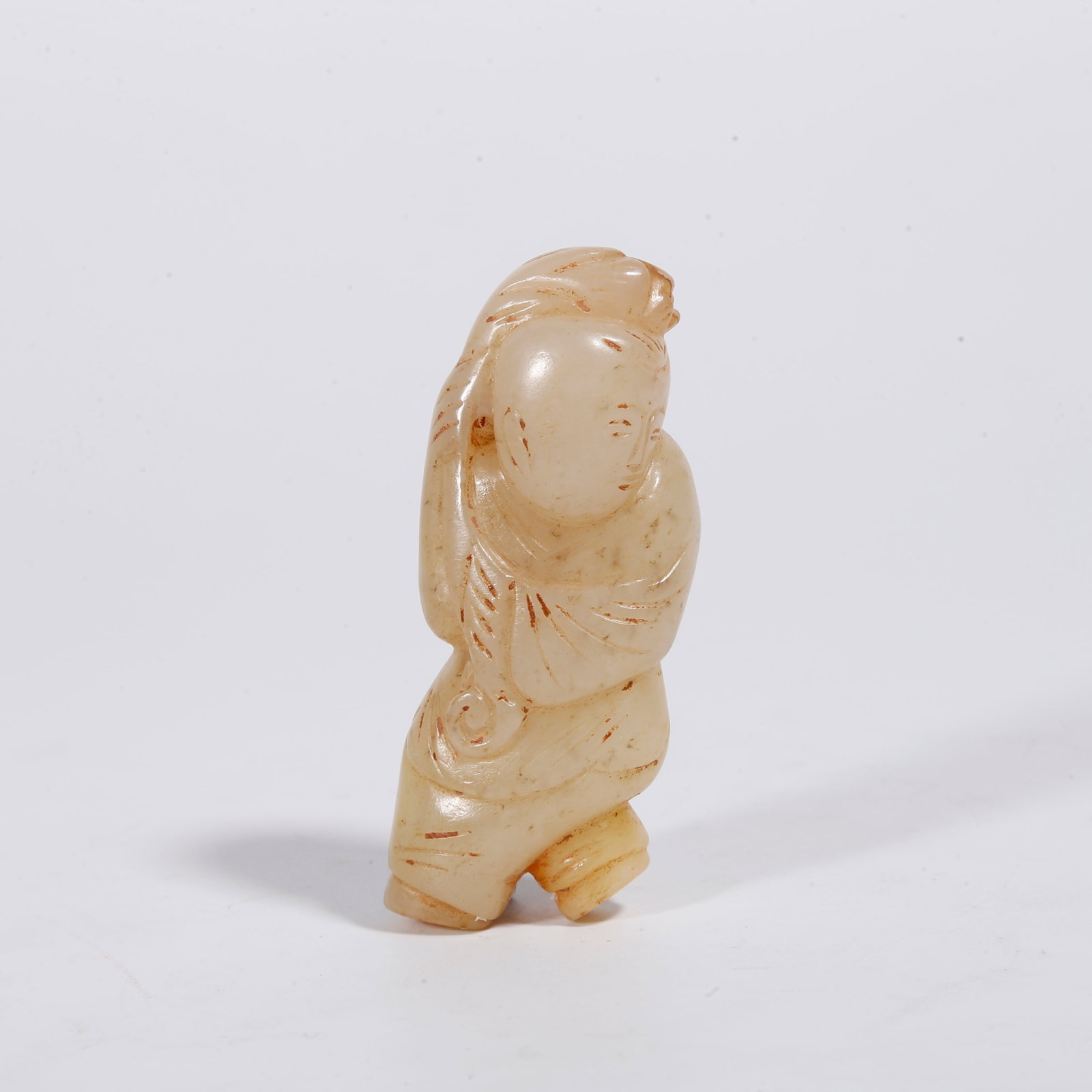 A HETIAN JADE BOY-SHAPED ORNAMENT: Hetian Jade Boy-shaped Ornament