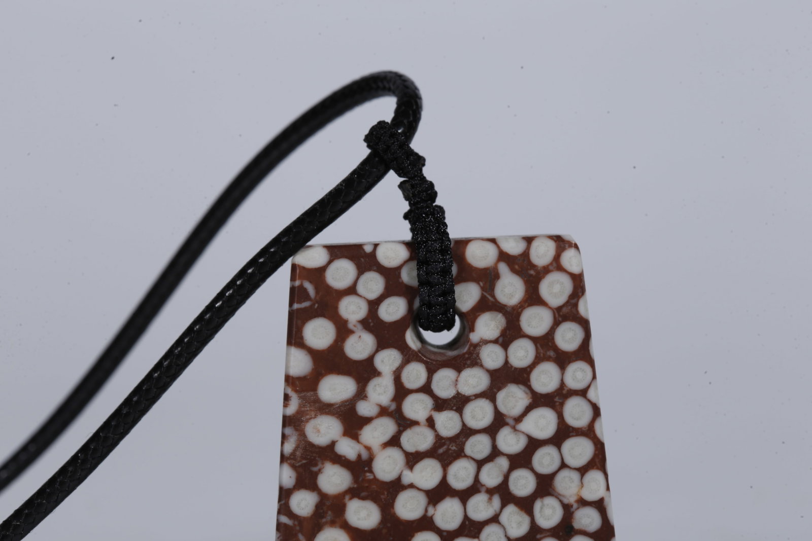 A STONE PENDANT - 2