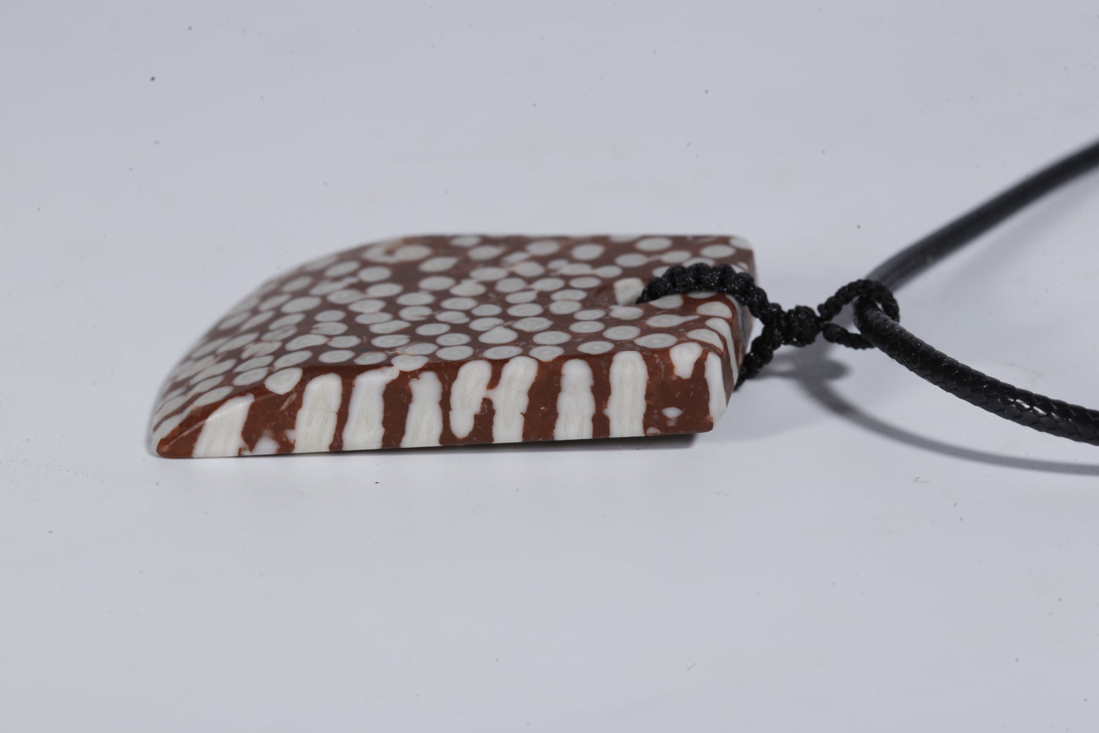 A STONE PENDANT - 6