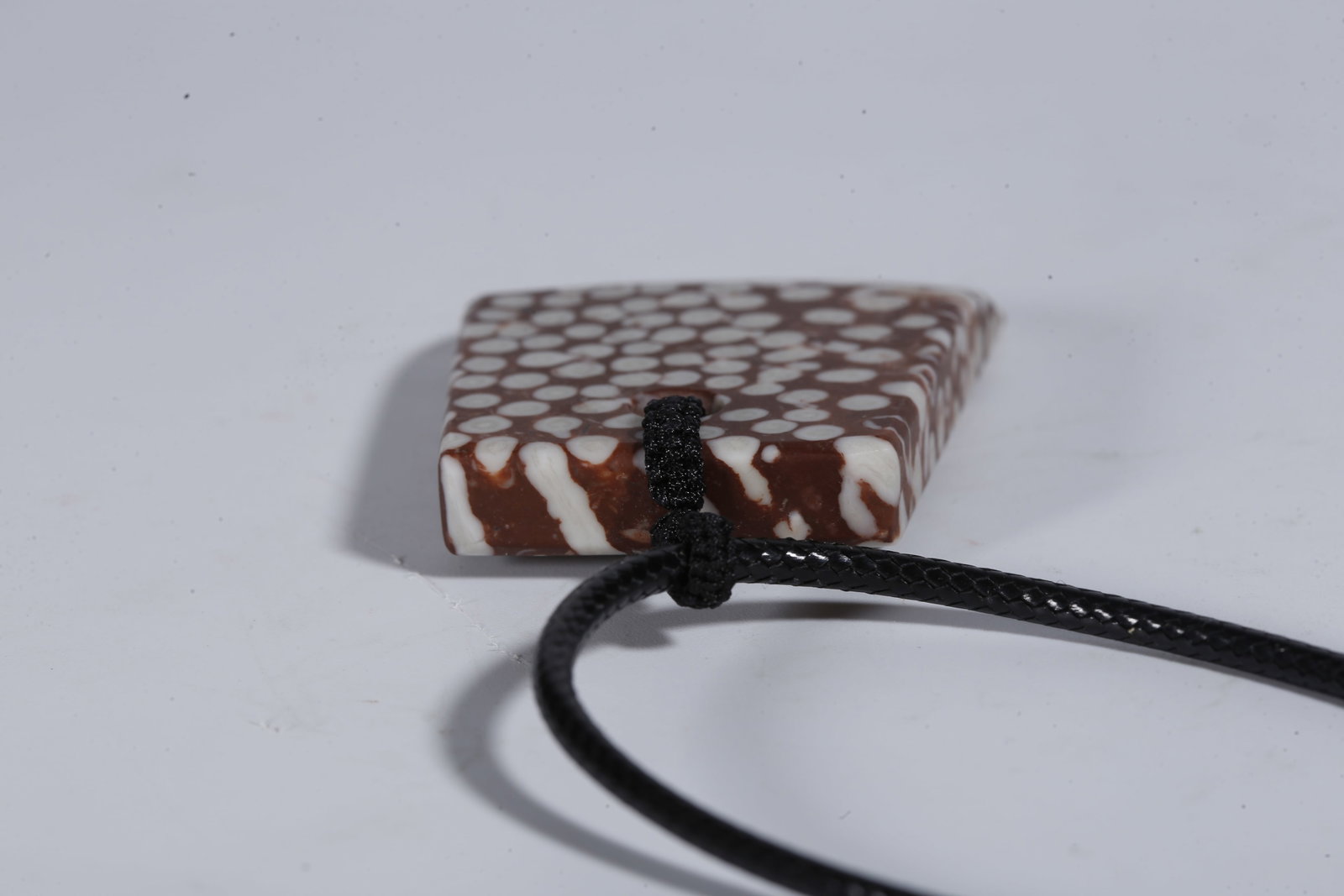 A STONE PENDANT - 7