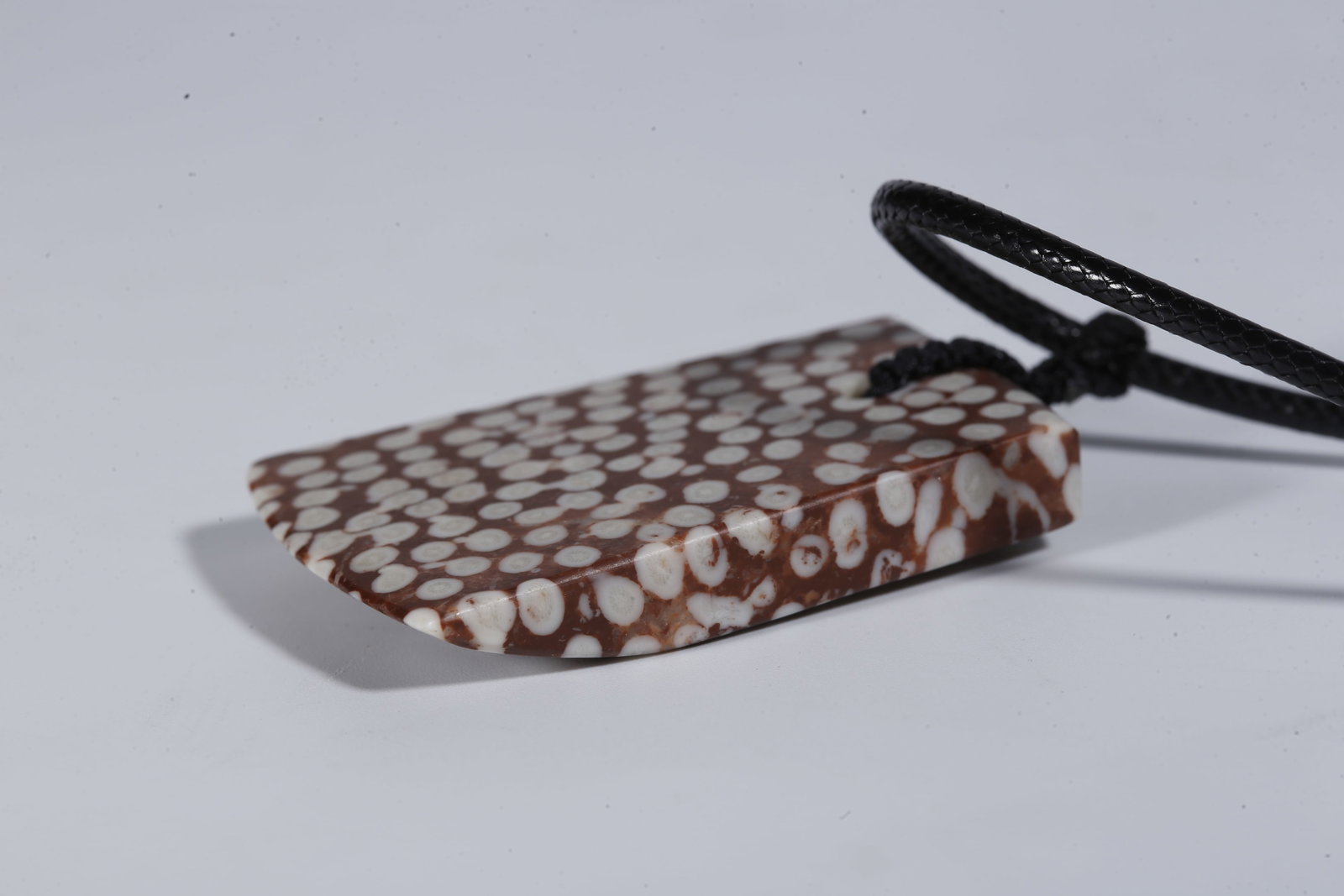 A STONE PENDANT - 8