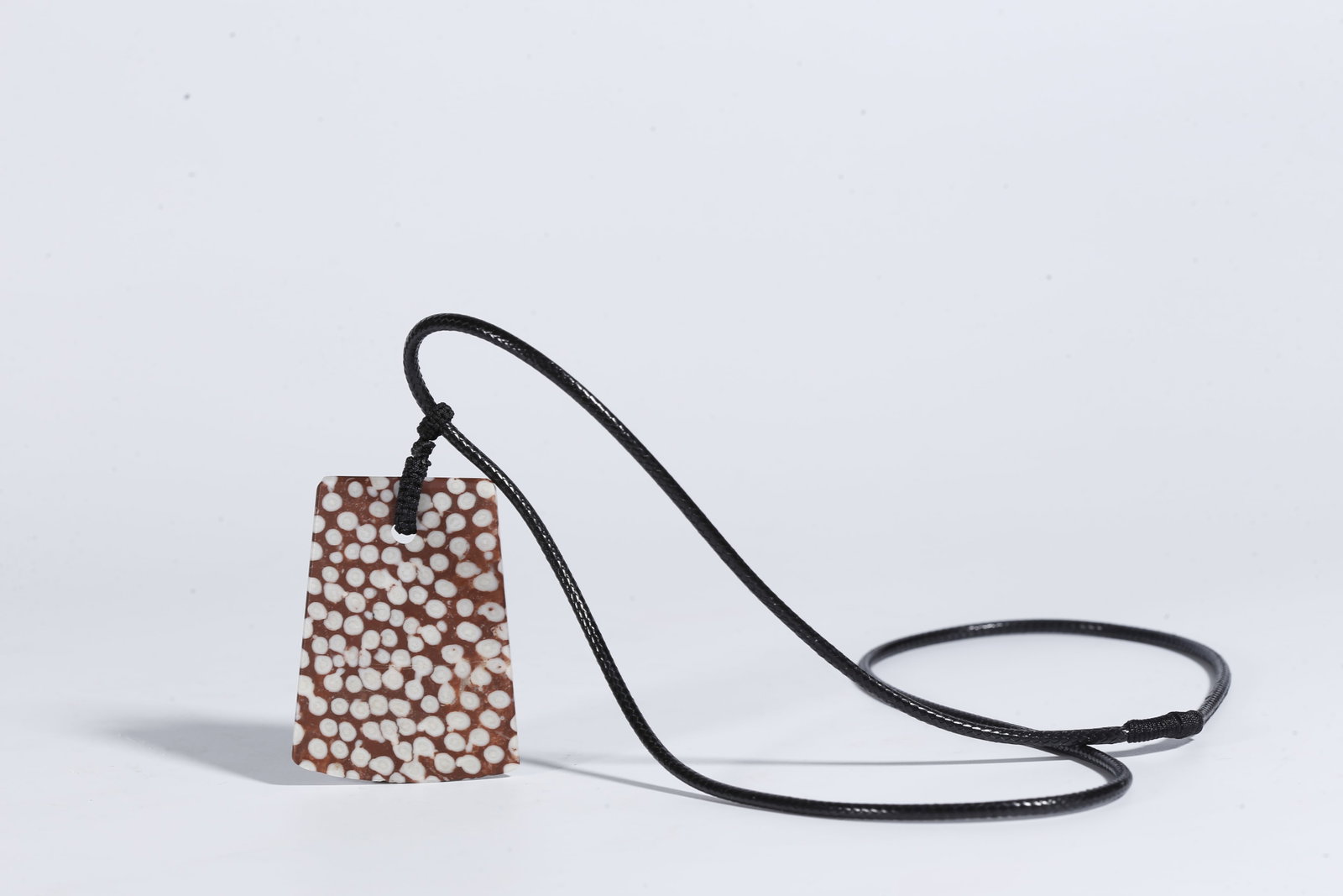 A STONE PENDANT - 9
