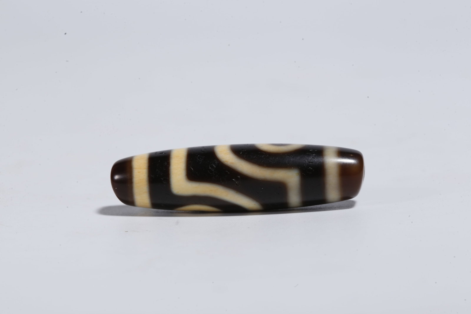 A TWO-EYED DZI BEAD - 2