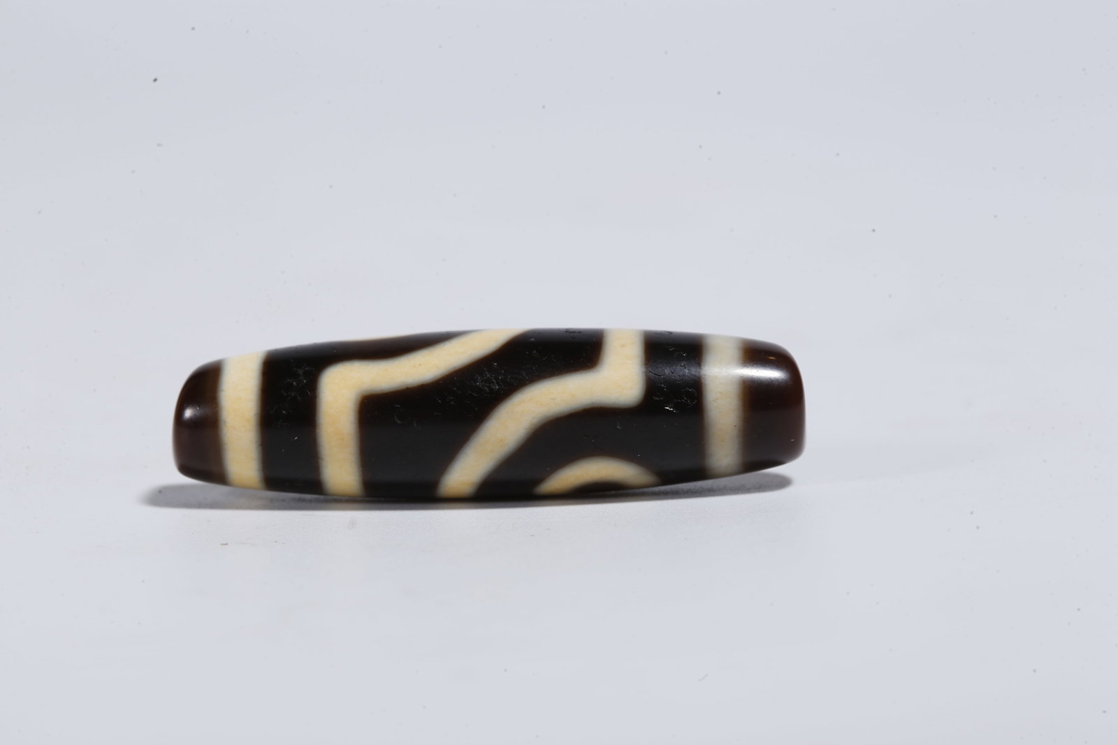 A TWO-EYED DZI BEAD - 4