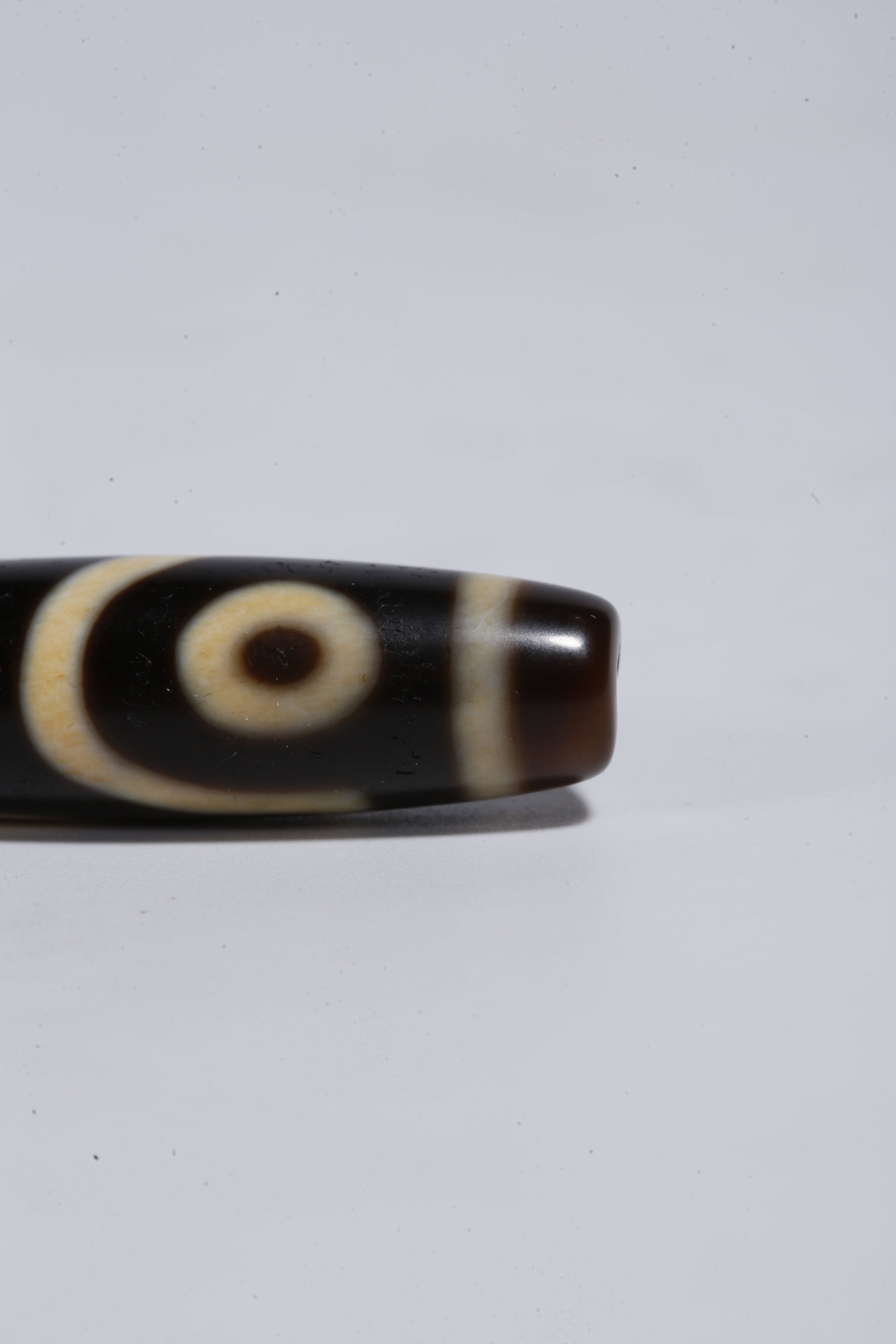A TWO-EYED DZI BEAD - 5
