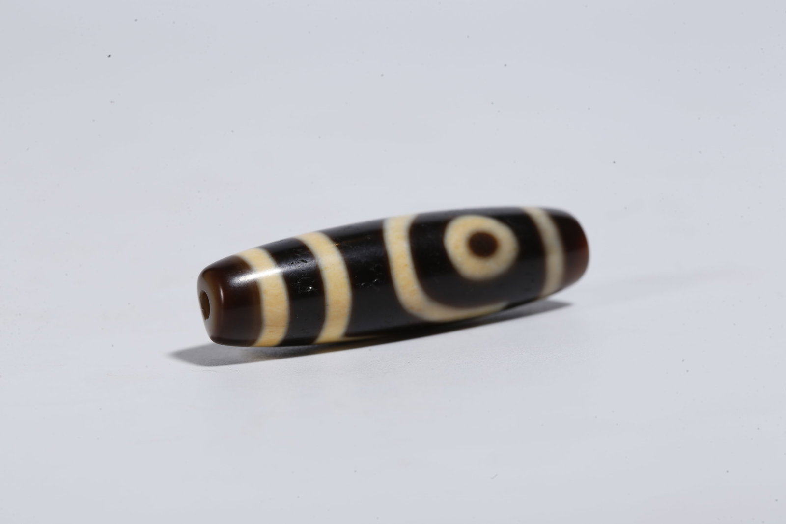 A TWO-EYED DZI BEAD - 7