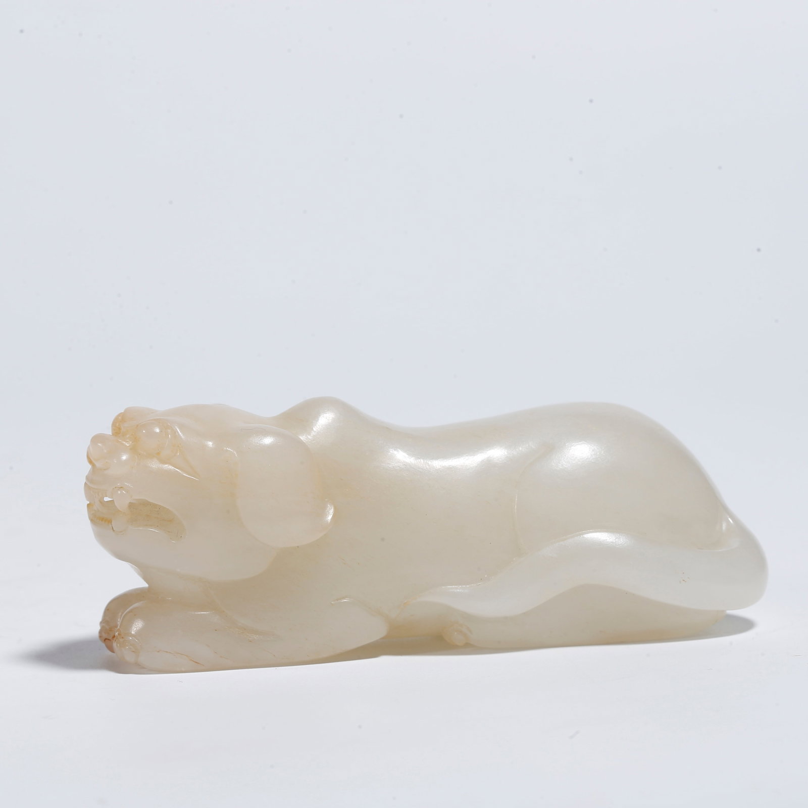A HETIAN JADE BEAST-SHAPED ORNAMENT: Hetian Jade Beast-Shaped Ornament