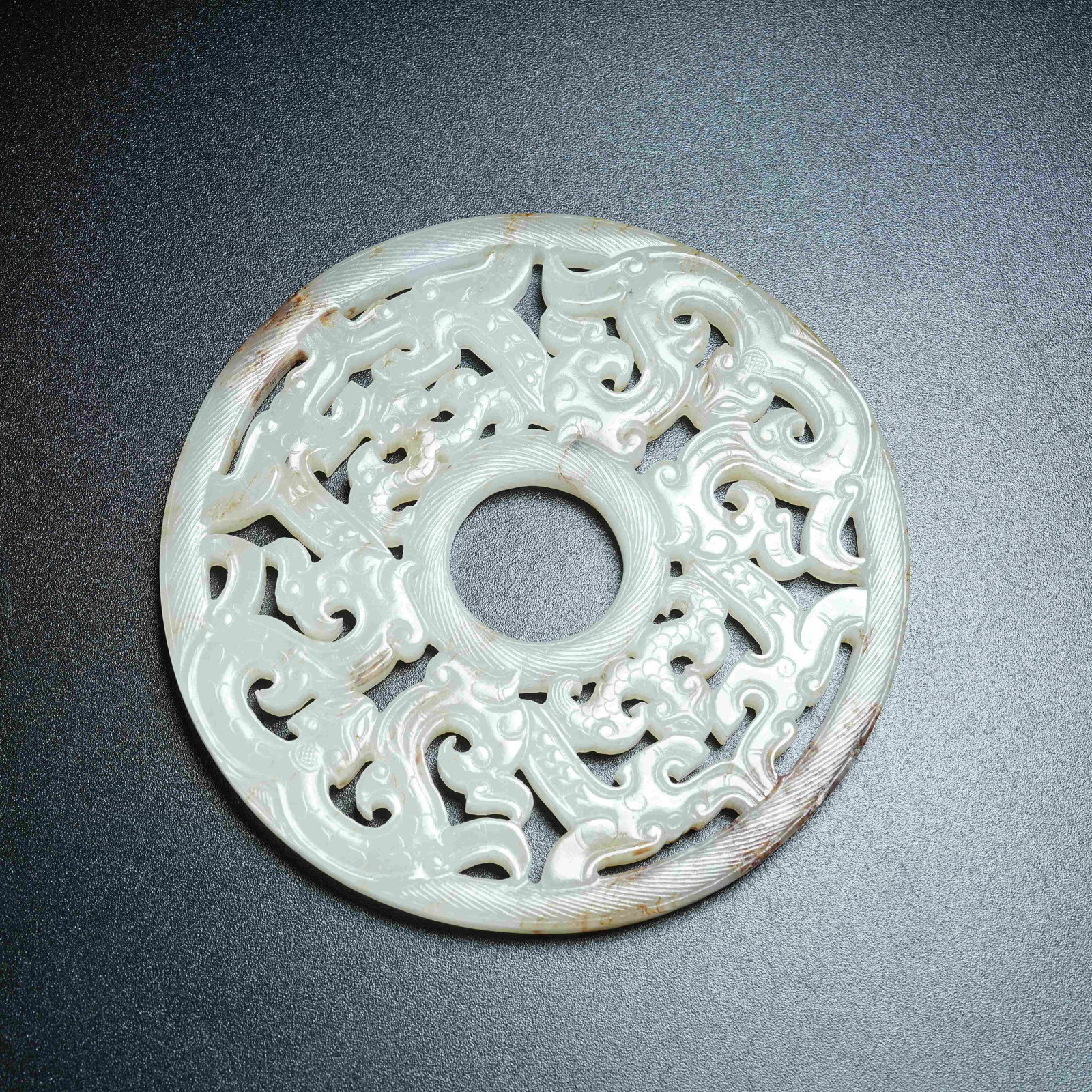A ANCIENT JADE BI DISC WITH CHI DRAGON PATTERNS: Ancient Jade Bi Disc with Chi Dragon Patterns