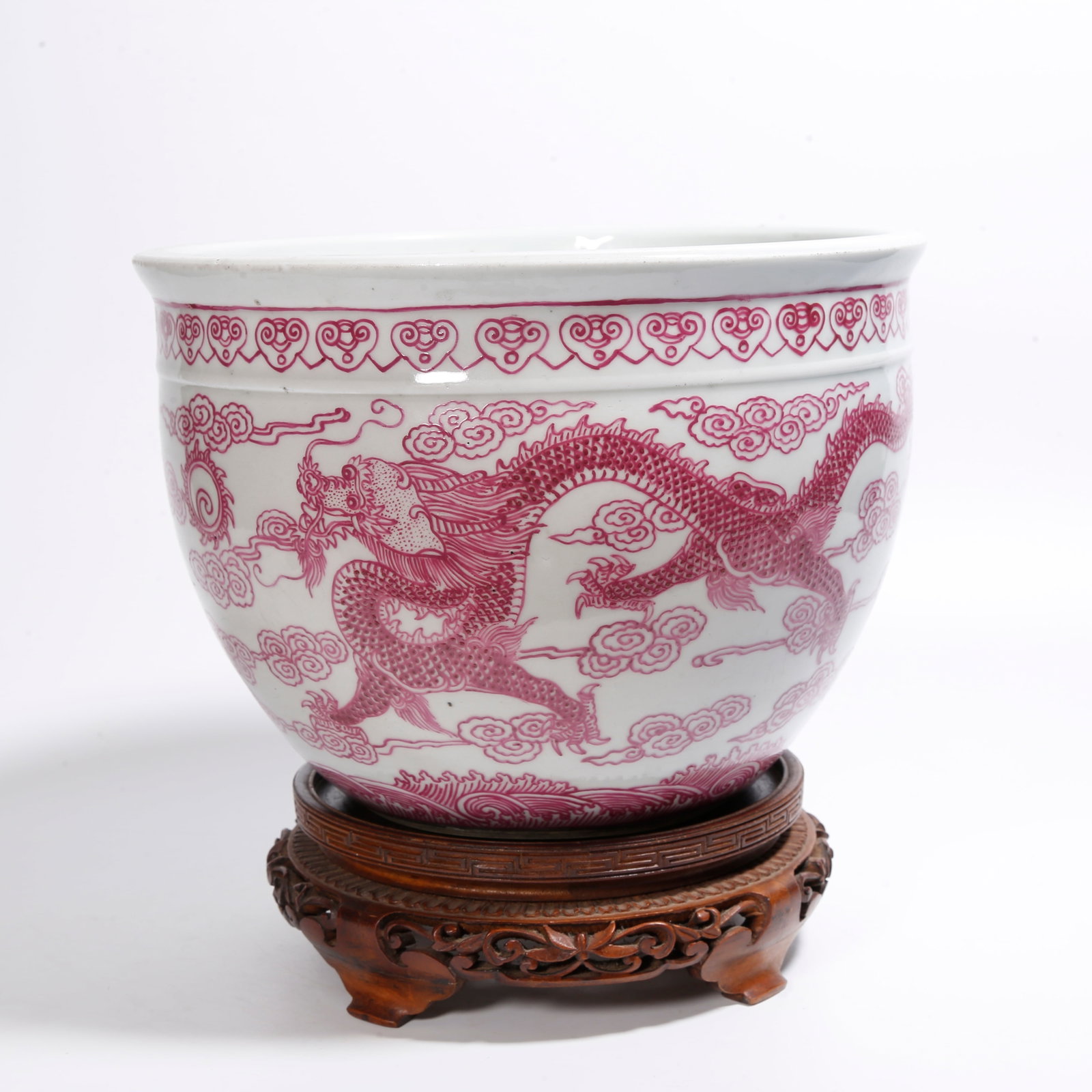 A CRIMSON RED TABLE JAR WITH DRAGON CHASING PEARL PATTERN: Crimson Red Table Jar with Dragon Chasing Pearl Pattern