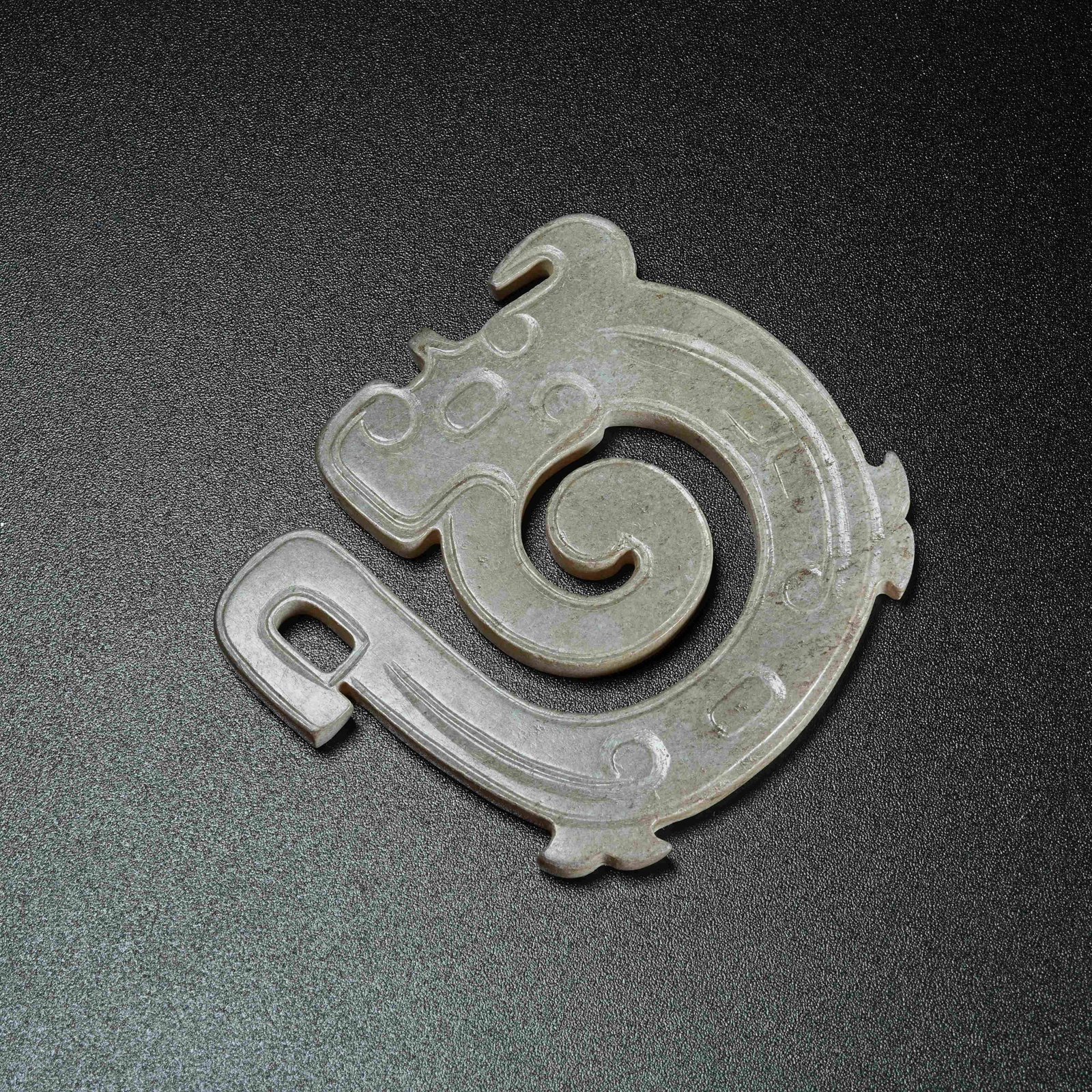 A ANCIENT JADE COILED DRAGON PENDANT: Ancient Jade Coiled Dragon Pendant