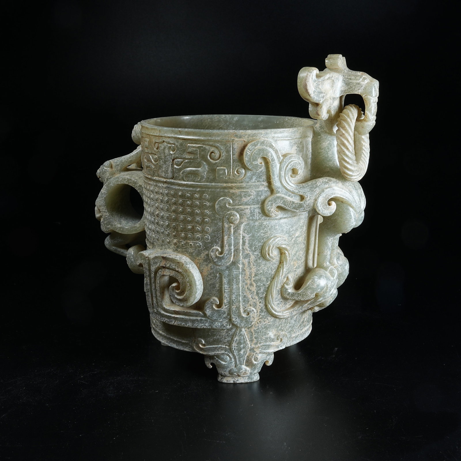 A ANCIENT JADE HANDLED CUP WITH DRAGON PATTERNS AND MOVABLE RINGS: Ancient Jade Handled Cup with Dragon Patterns and Movable Rings