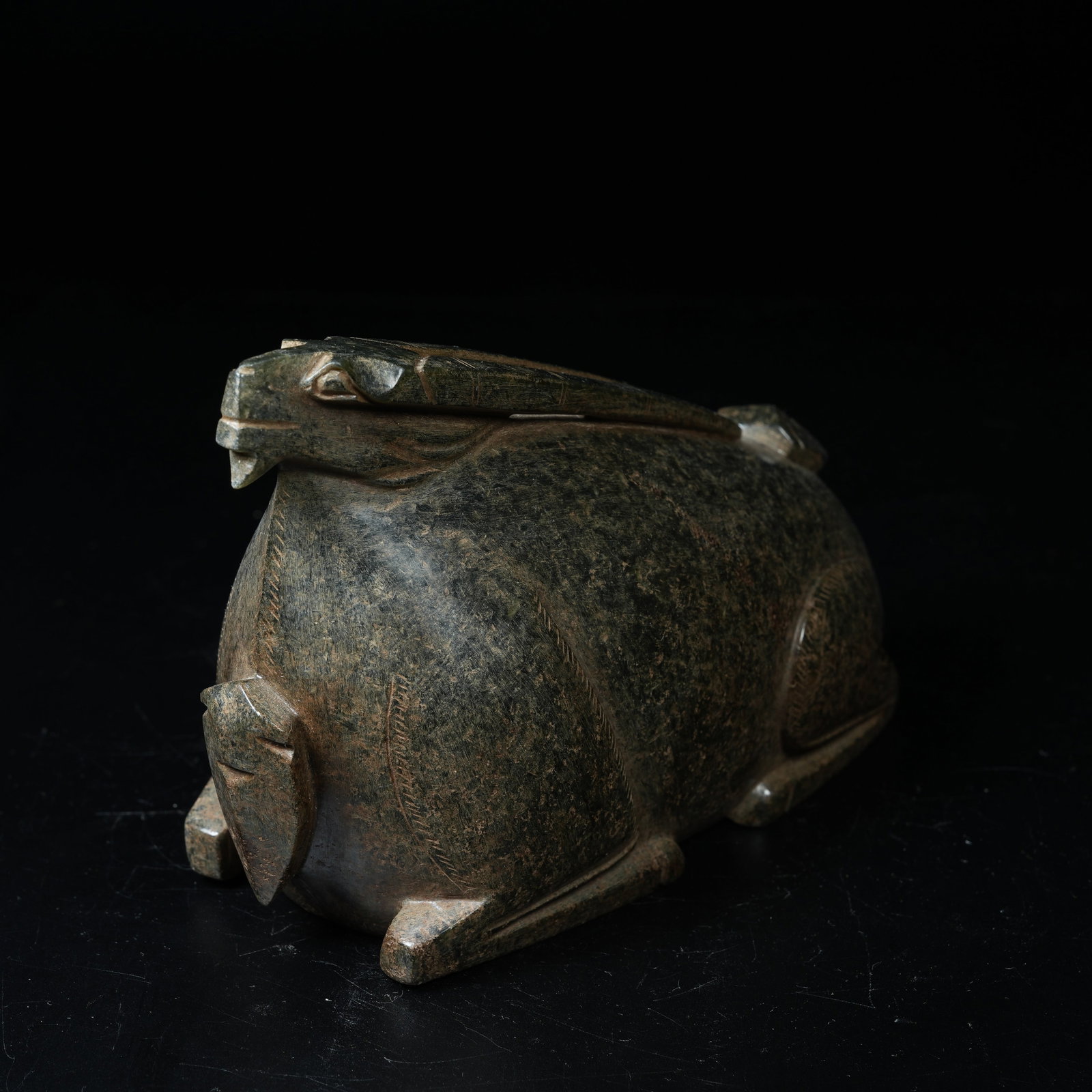 A ARCHAIC JADE RECUMBENT BEAST ORNAMENT: Archaic Jade Recumbent Beast Ornament