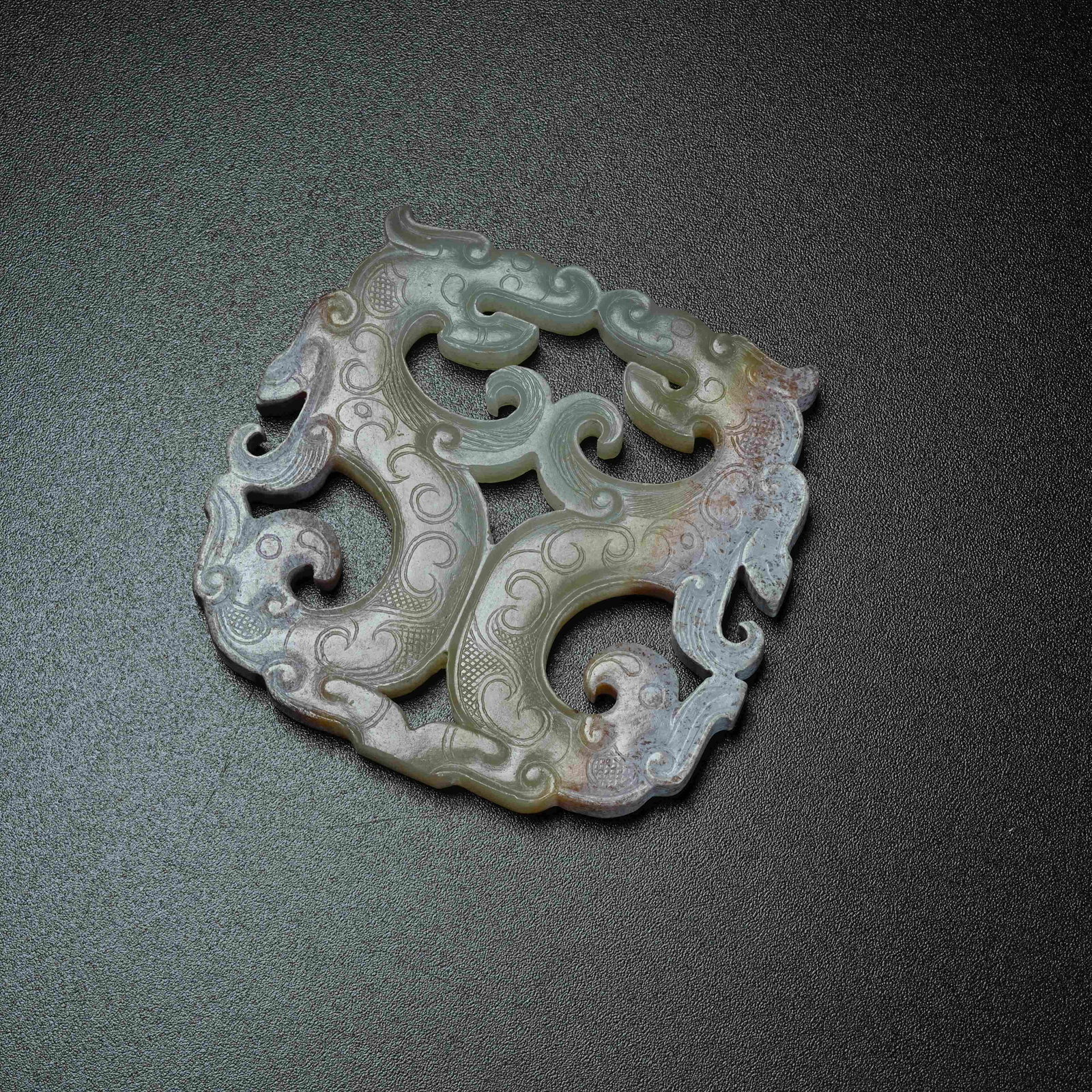 A ARCHAIC JADE S-SHAPED DRAGON PENDANT: Archaic Jade S-shaped Dragon Pendant