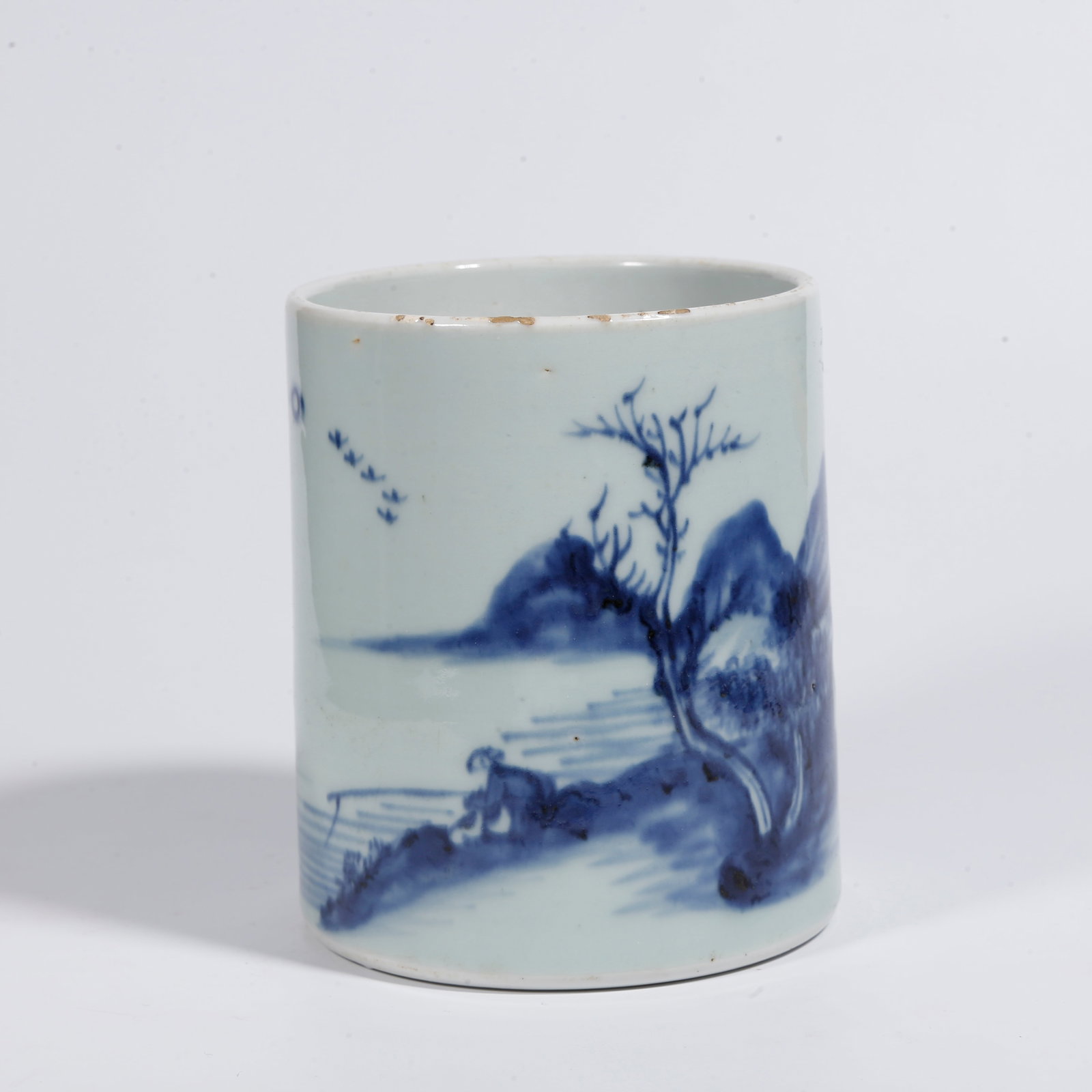 A BLUE AND WHITE BRUSH POT WITH LANDSCAPE AND FIGURE PATTERN: Blue and White Brush Pot with Landscape and Figure Pattern