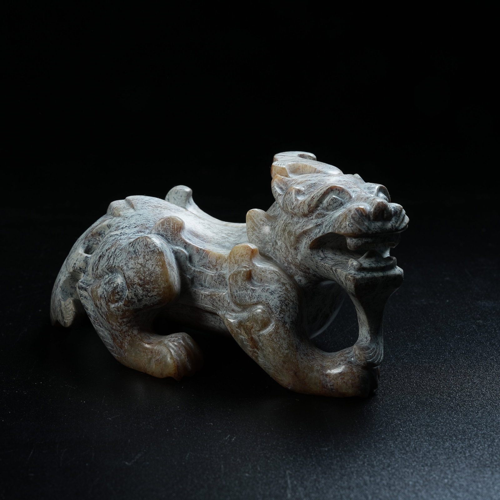 A ANCIENT JADE AUSPICIOUS BEAST ORNAMENT: Ancient Jade Auspicious Beast Ornament