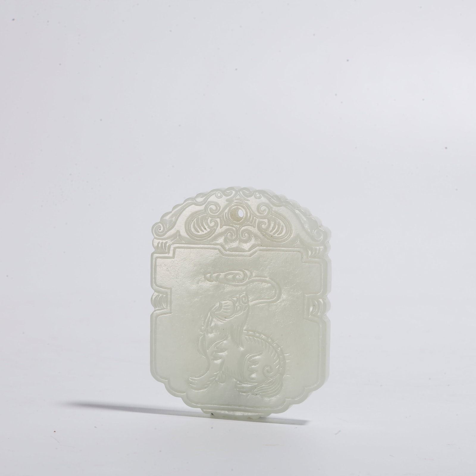 A HETIAN JADE PLAQUE CARVED WITH BEAST PATTERN: Hetian Jade Plaque Carved with Beast Pattern