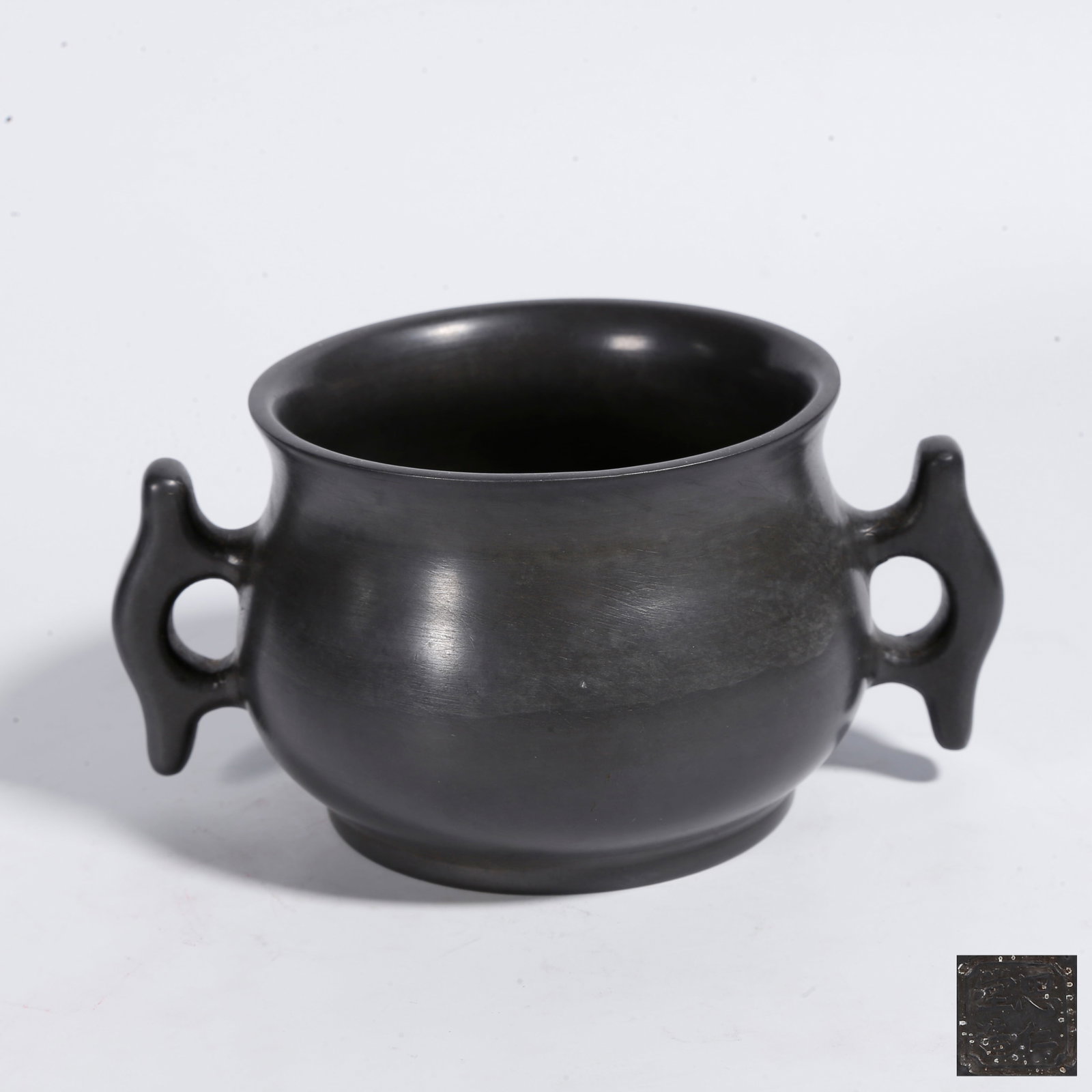 A TIN CENSER WITH DOUBLE HALBERD HANDLES: Tin Censer with Double Halberd Handles