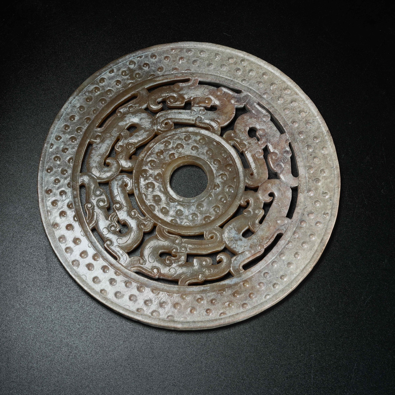 A ARCHAIC JADE BI DISC WITH DRAGON PATTERN: Archaic Jade Bi Disc with Dragon Pattern