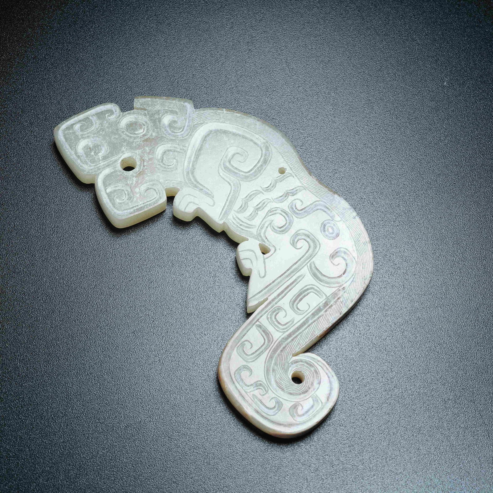 A ANCIENT JADE HUANG ARC WITH BEAST PATTERNS: Ancient Jade Huang Arc with Beast Patterns
