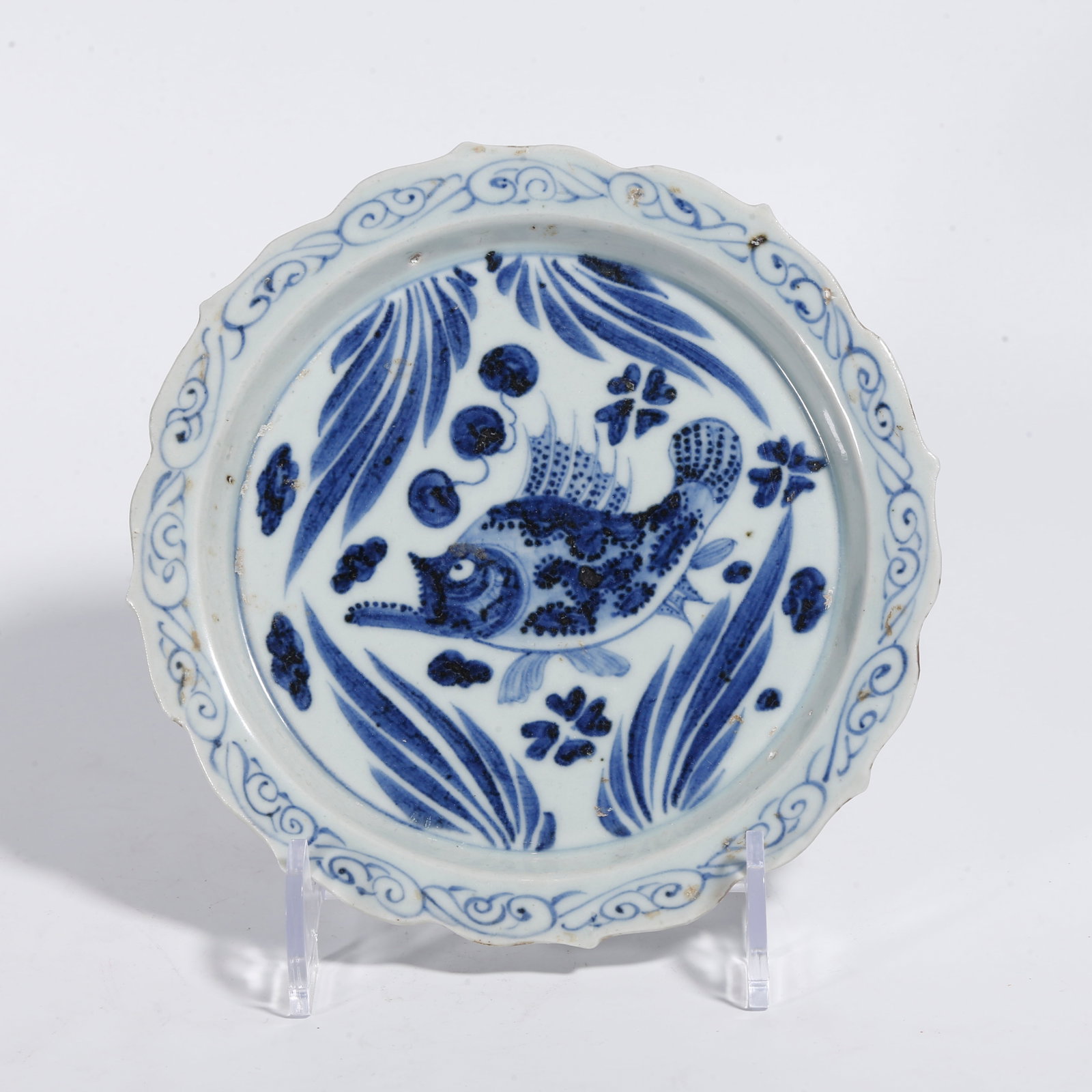 A BLUE AND WHITE PLATE WITH FISH AND AQUATIC WEED PATTERN: Blue and White Plate with Fish and Aquatic Weed Pattern