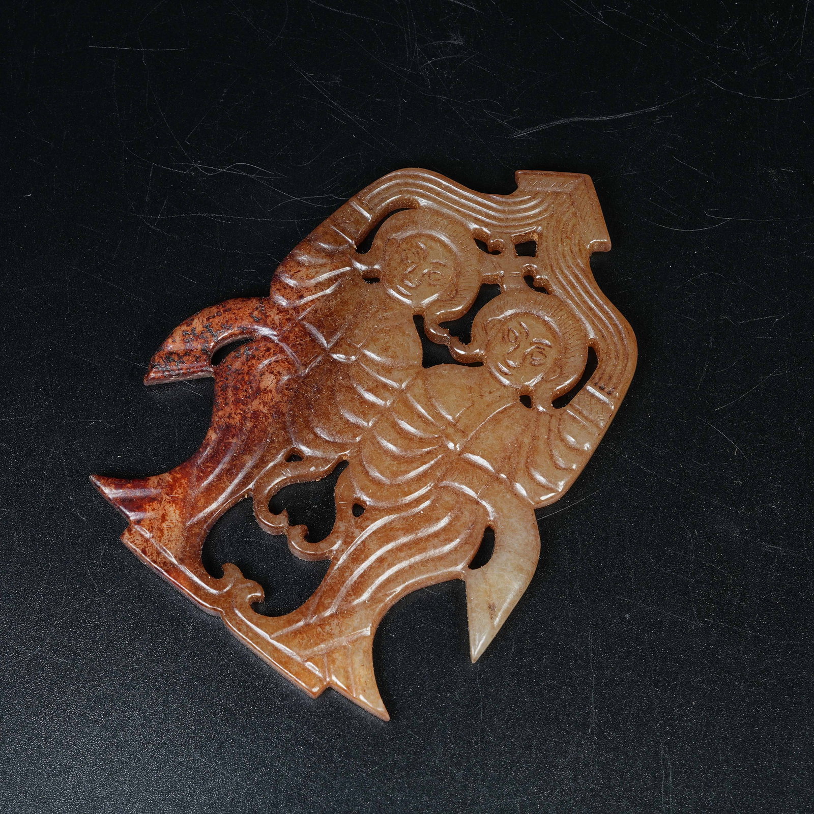A ARCHAIC JADE DANCING FIGURE PENDANT (1 of 8)
