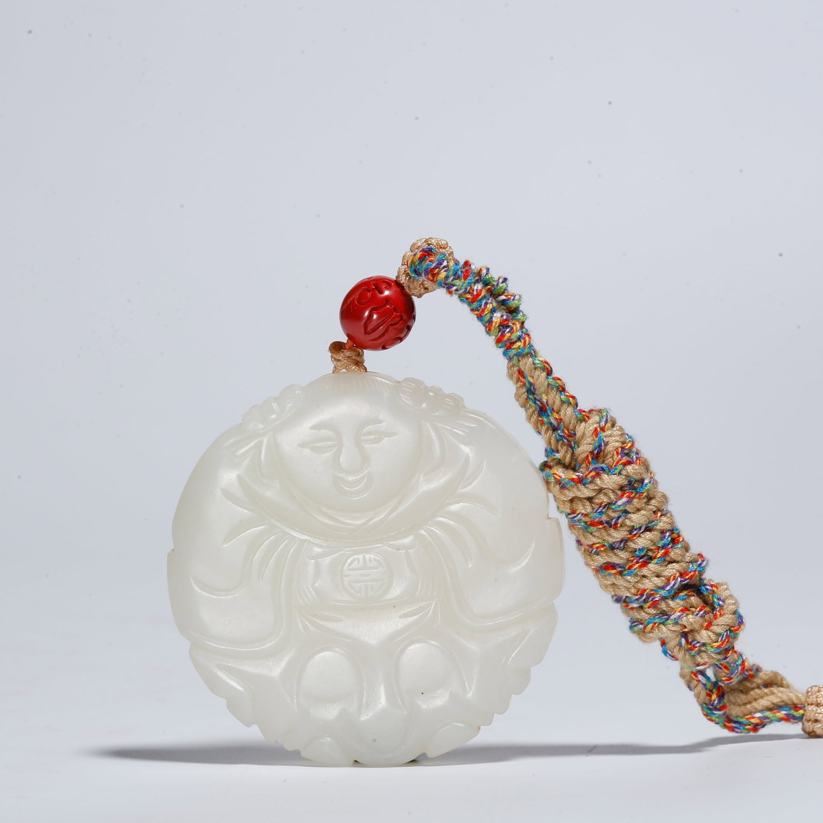 A HETIAN JADE PENDANT WITH BOY MOTIF (1 of 9)