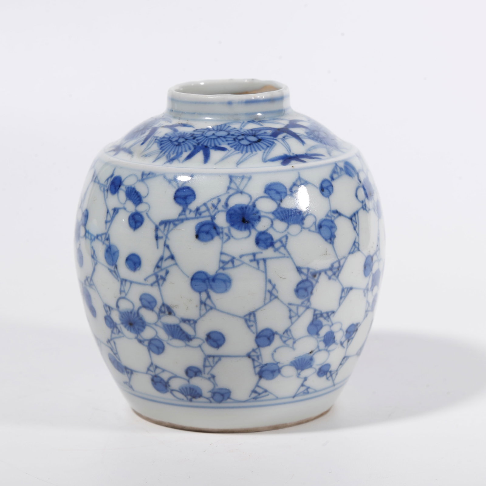 A BLUE AND WHITE JAR WITH FLORAL PATTERNS: Blue and White Jar with Floral Patterns