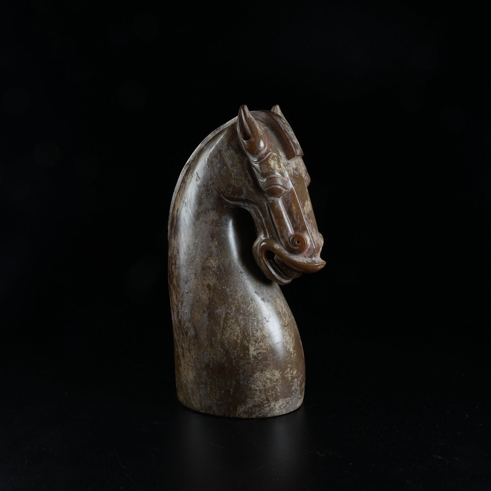 A ARCHAIC JADE HORSE HEAD ORNAMENT: Archaic Jade Horse Head Ornament