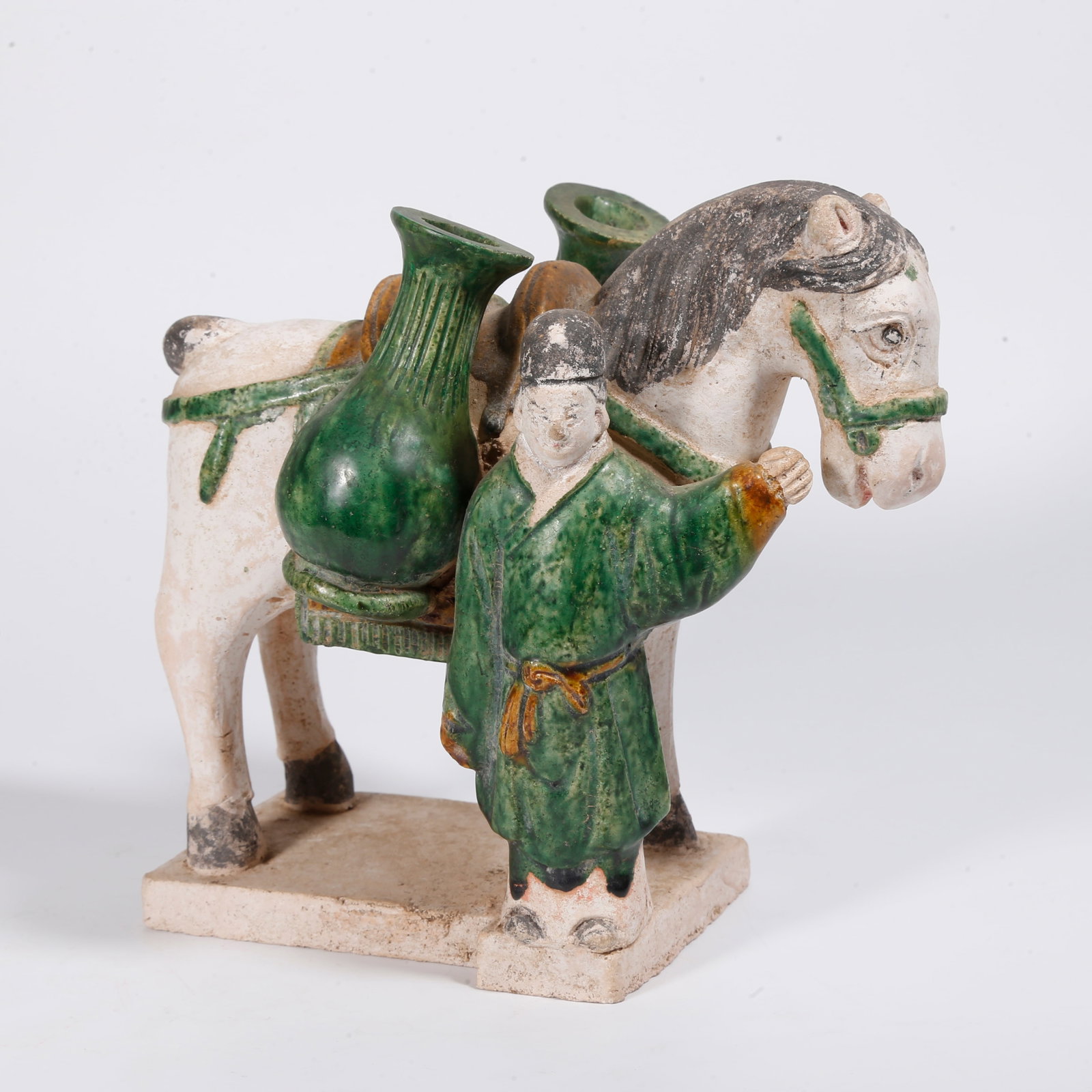 A TRI-COLOR POTTERY FIGURE AND HORSE TOMB FIGURINE (1 of 9)
