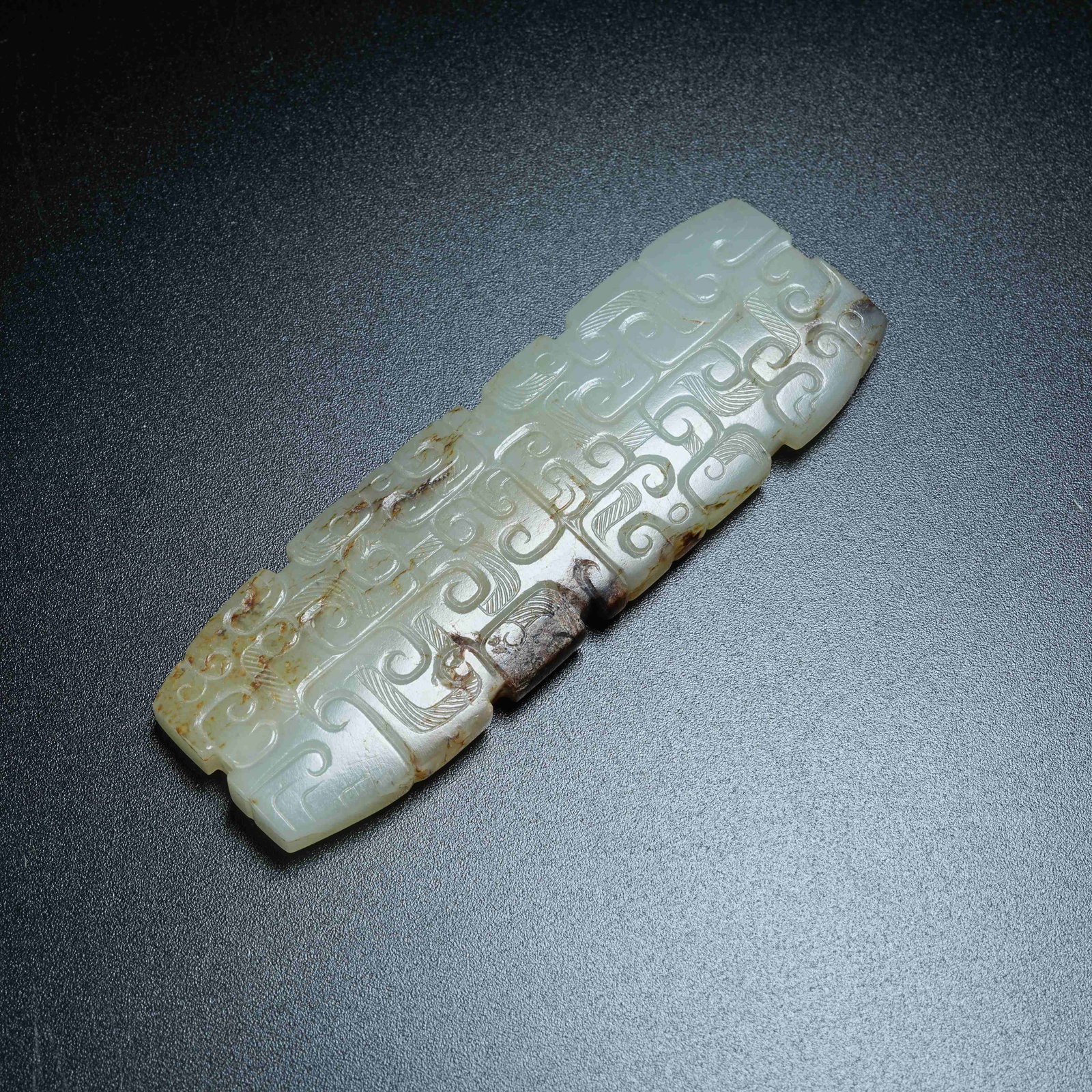 A ANCIENT JADE PENDANT WITH HOOKED CLOUD PATTERNS (1 of 8)
