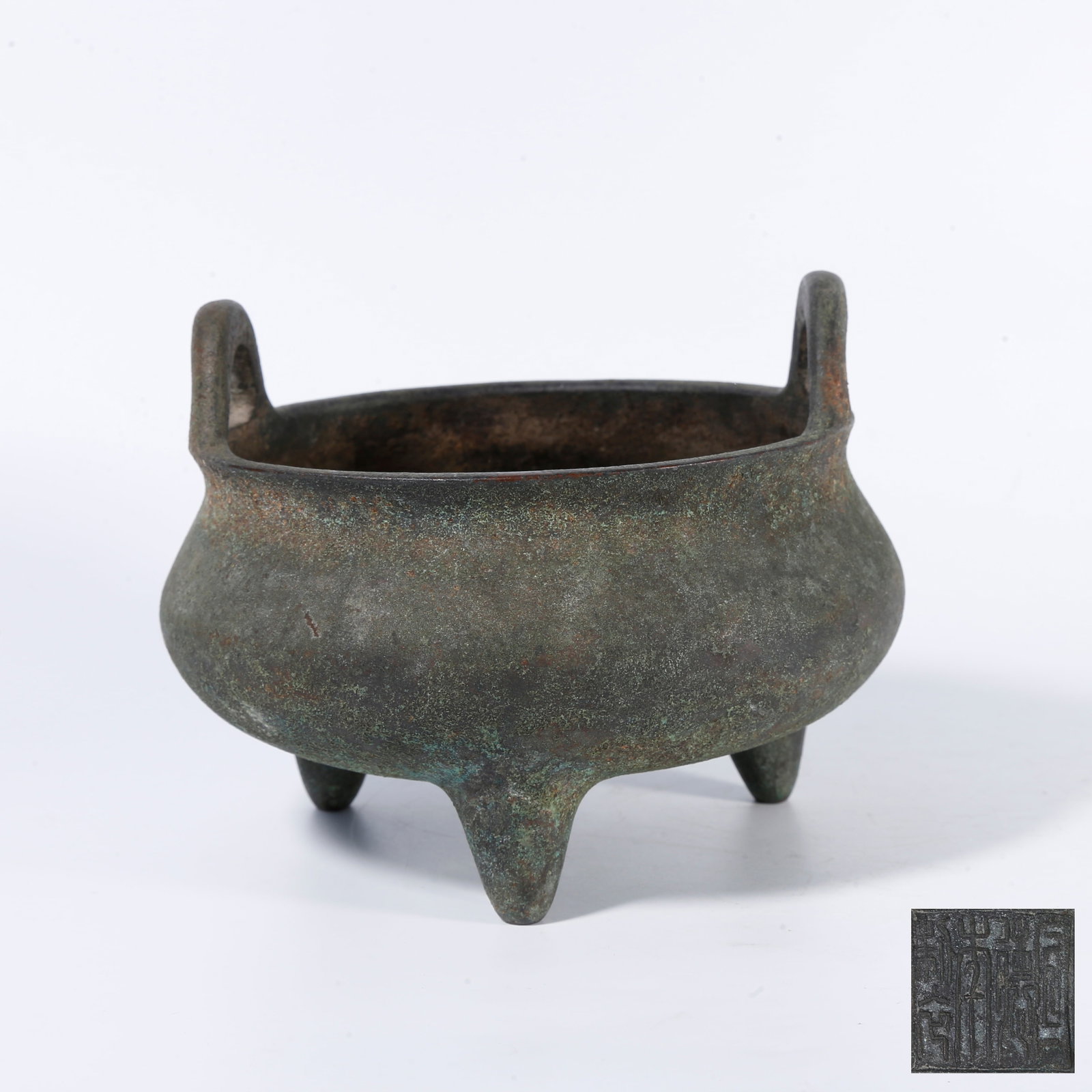 A BRONZE THREE?LEGGED UPRIGHT?EAR INCENSE CENSER: Bronze three?legged upright?ear incense censer