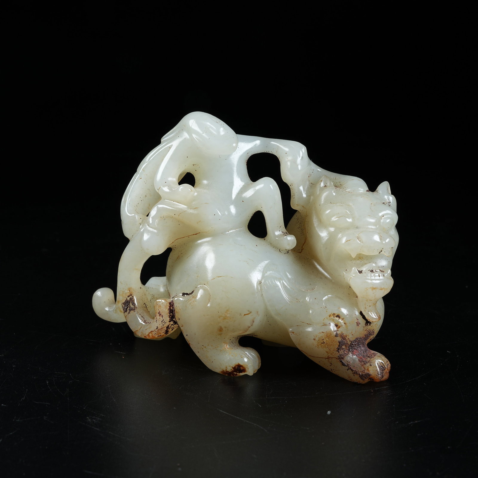 A ANCIENT JADE WINGED FIGURE RIDING BEAST ORNAMENT: Ancient Jade Winged Figure Riding Beast Ornament