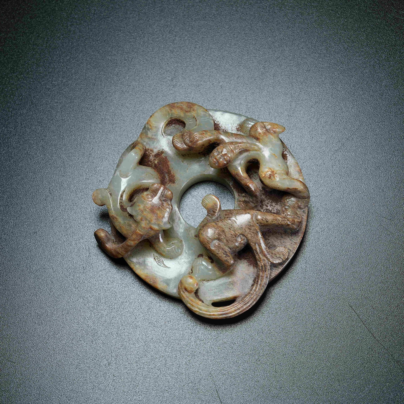 A ANCIENT JADE SURROUNDING BI DISC WITH CHI DRAGON PATTERN: Ancient Jade Surrounding Bi Disc with Chi Dragon Pattern