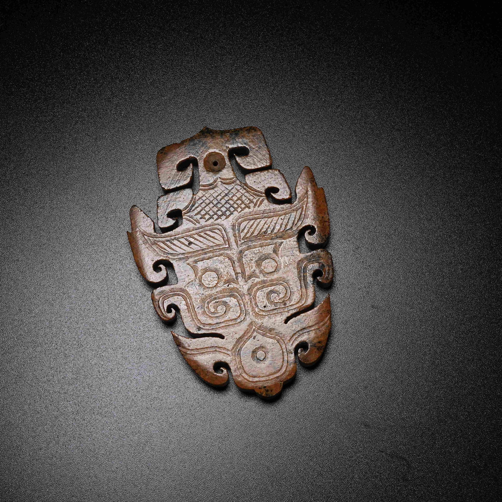 A ARCHAIC JADE PENDANT WITH BEAST MASK PATTERN: Archaic Jade Pendant with Beast Mask Pattern