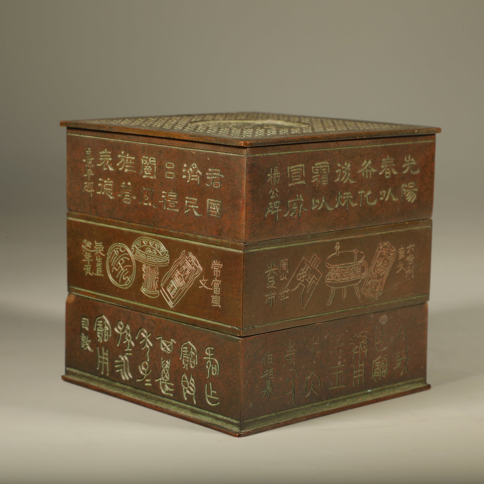 A MULTI?TIER BRONZE CENSER CARVED WITH PINE?CRANE MOTIFS AND INSCRIBED VERSES: Multi?tier Bronze Censer Carved with Pine?crane Motifs and Inscribed Verses