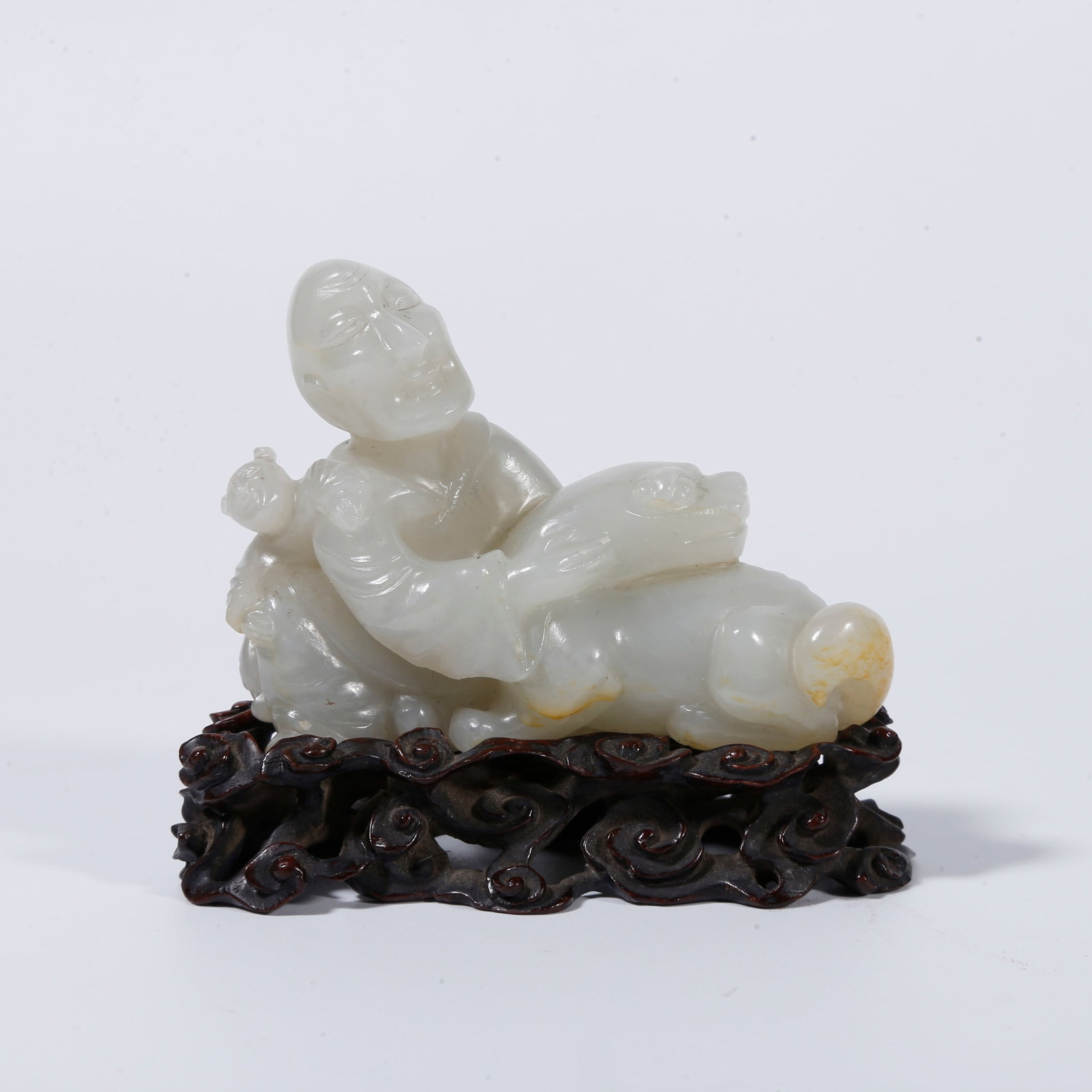 A HETIAN JADE CARVED ARHAT STATUE: Hetian jade carved arhat statue