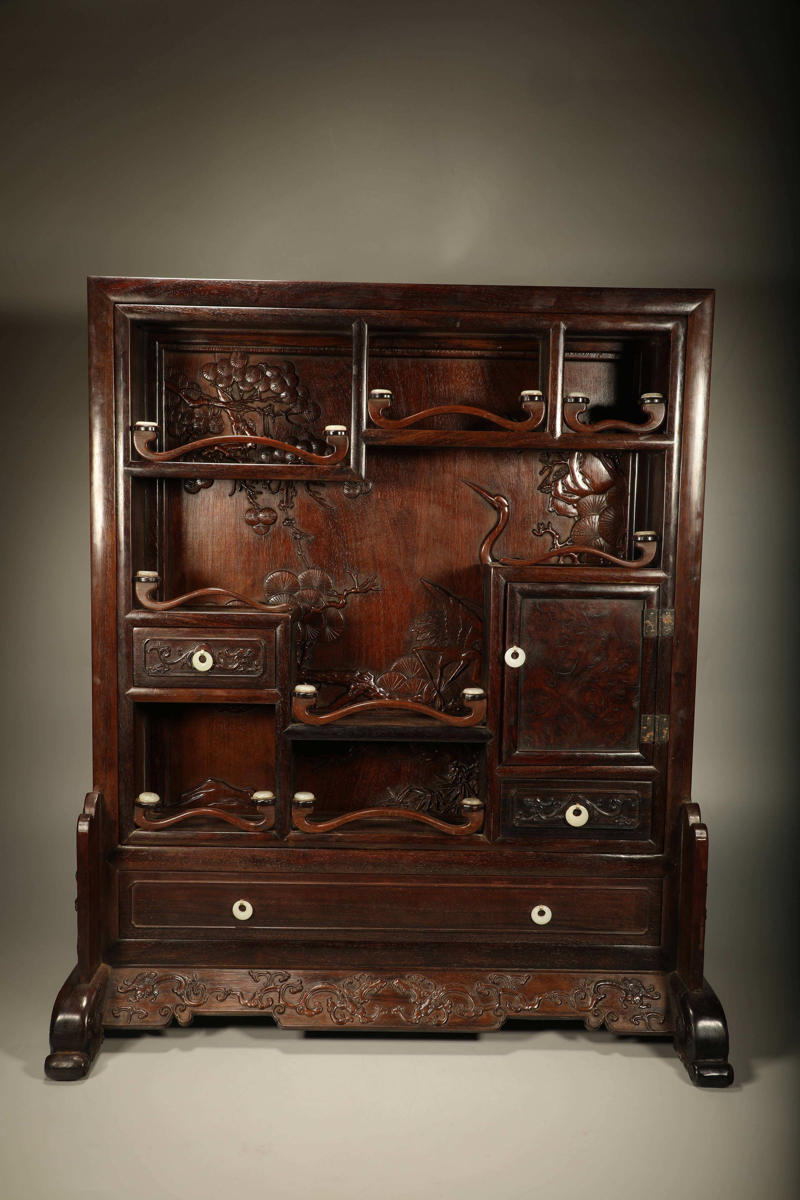 A HUANGHUALI CURIO CABINET CARVED WITH PINE?CRANE?RUYI MOTIFS AND JADE INLAYS: Huanghuali Curio Cabinet Carved with Pine?crane?ruyi Motifs and Jade Inlays