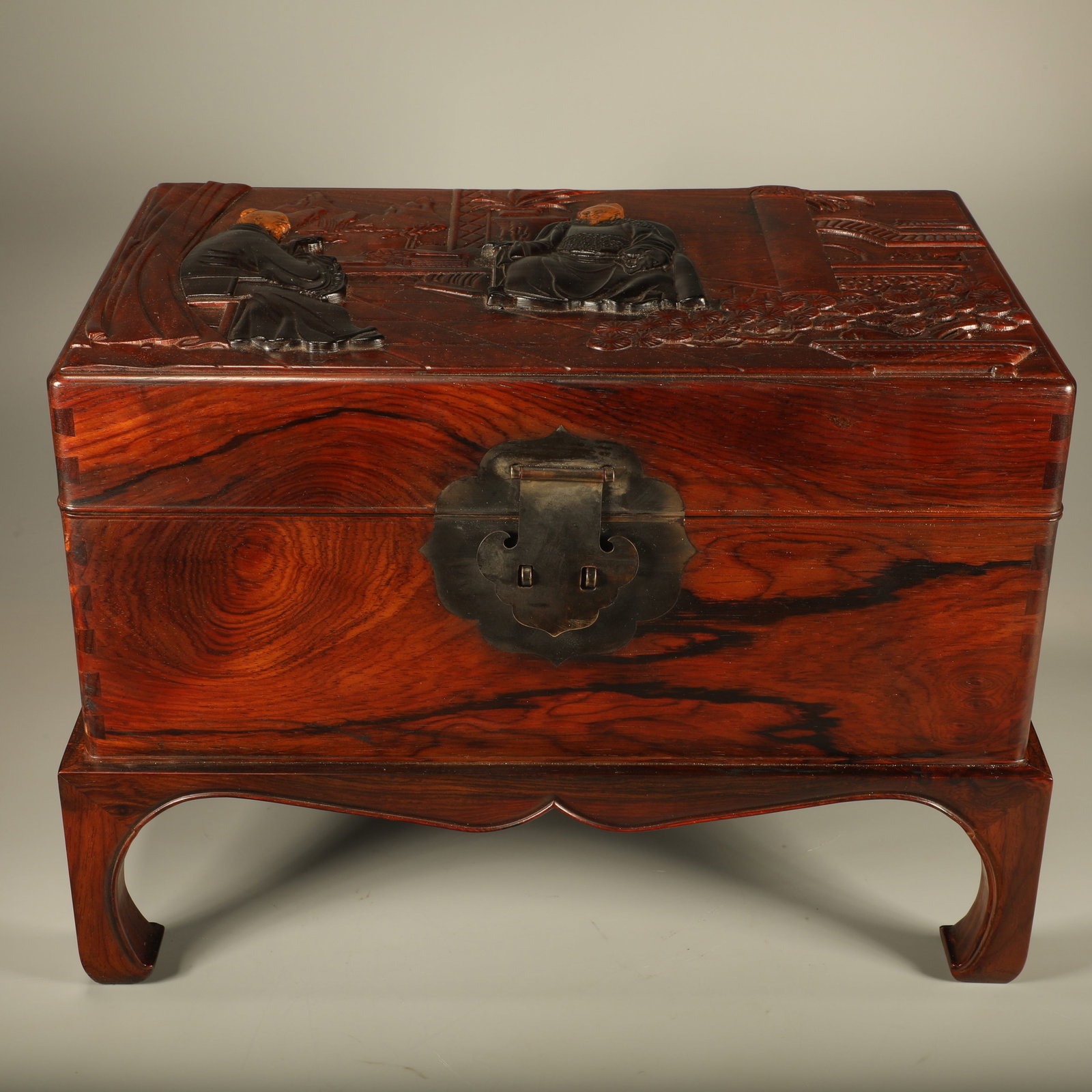 A HUANGHUALI BOOK CHEST INLAID WITH SANDALWOOD CARVED WITH FIGURE STORY SCENES (1 of 7)