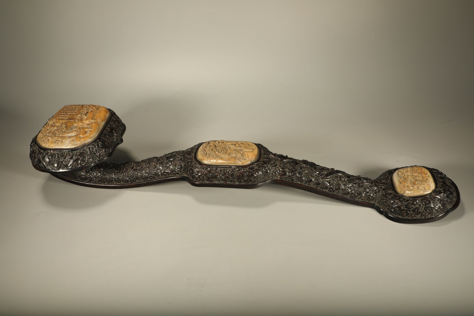A LARGE SANDALWOOD RUYI SCEPTER INLAID WITH SHOUSHAN STONE CARVED WITH FU?LU?SHOU MOTIFS (1 of 7)