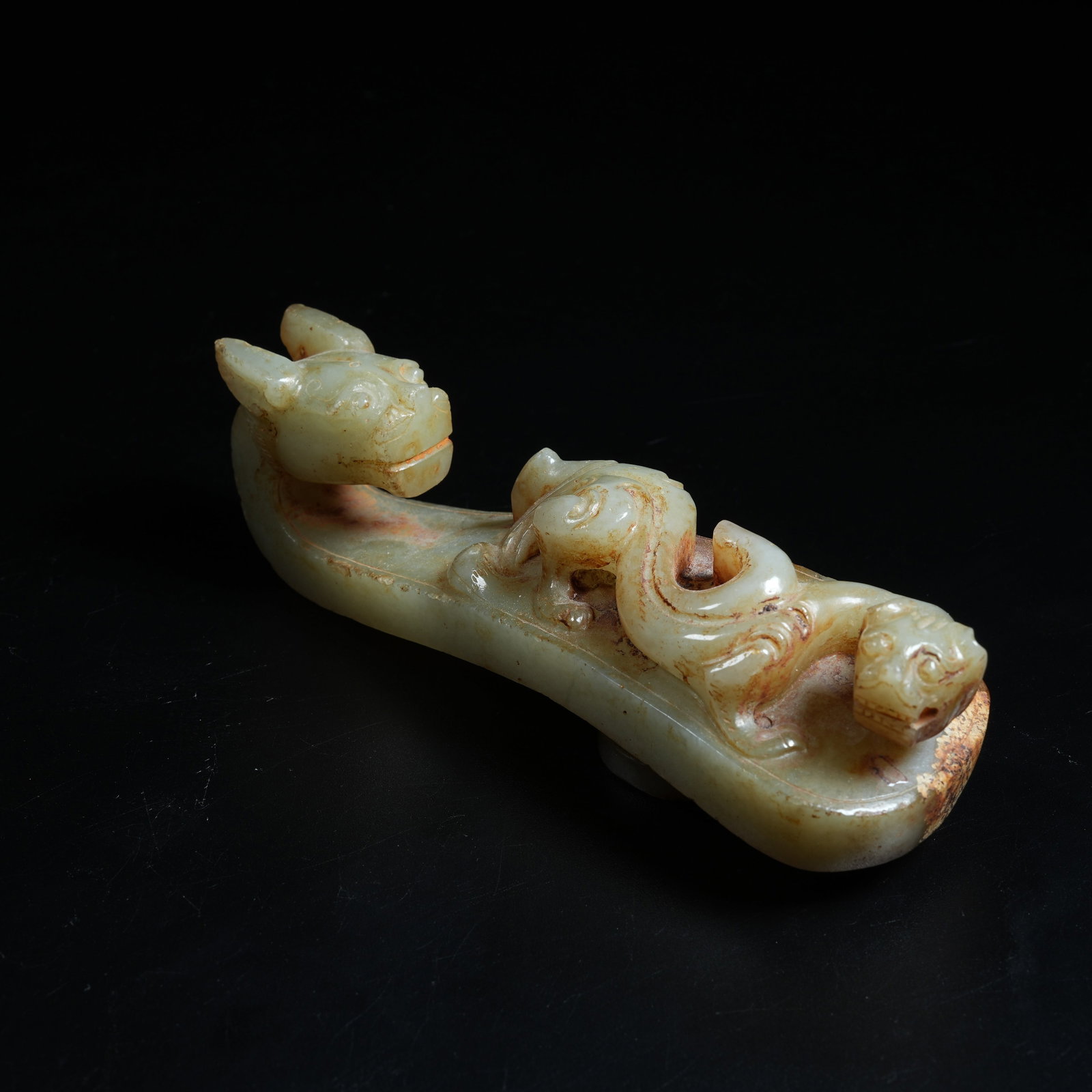 A ANCIENT JADE BELT HOOK CARVED WITH CHI DRAGON PATTERNS (1 of 7)