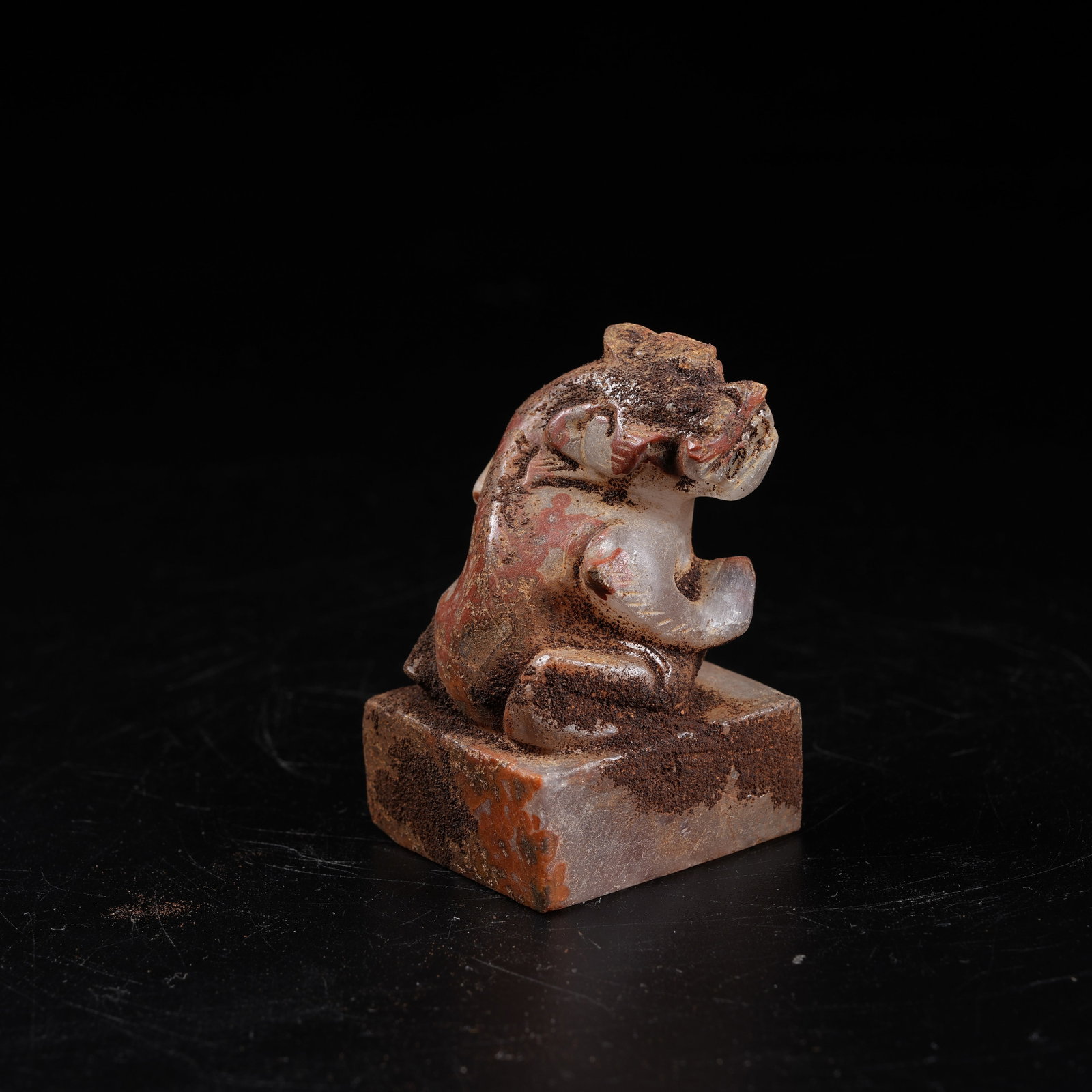 A WARRING STATES RED AGATE SEAL WITH AUSPICIOUS BEAST KNOB (1 of 8)