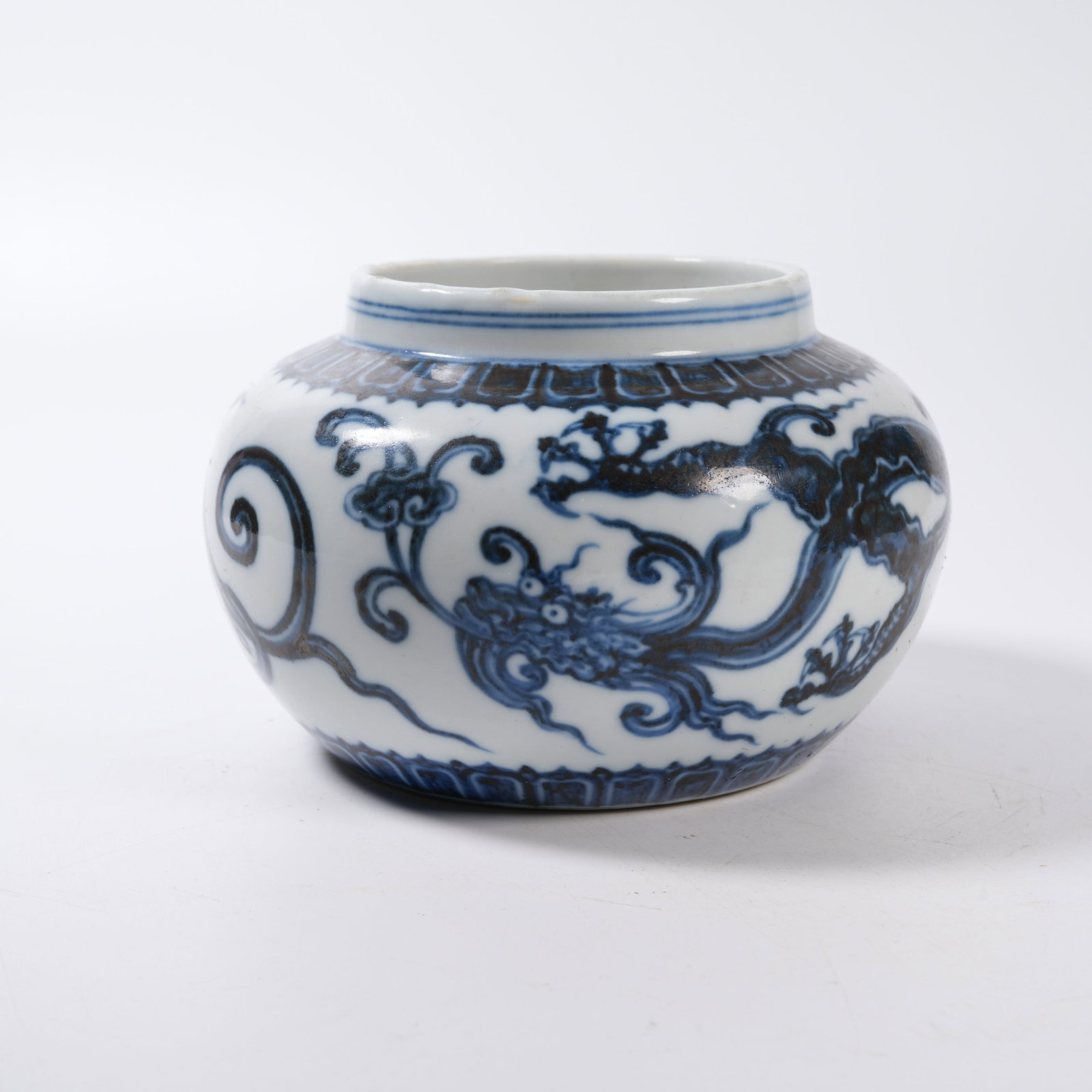 A BLUE AND WHITE JAR WITH CLOUD DRAGON PATTERN: Blue and White Jar with Cloud Dragon Pattern