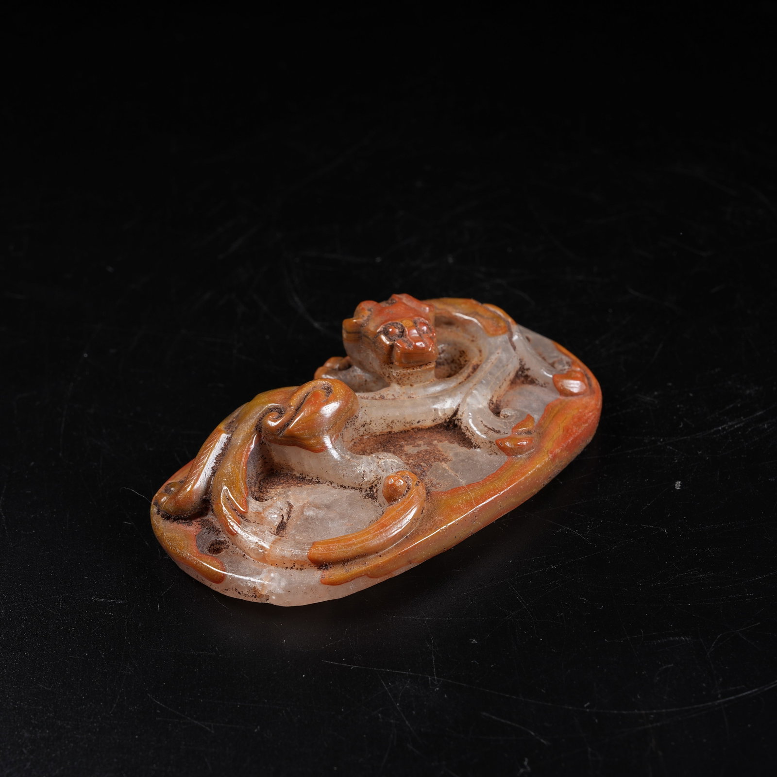 A WARRING STATES RED AGATE CHI DRAGON PENDANT (1 of 7)