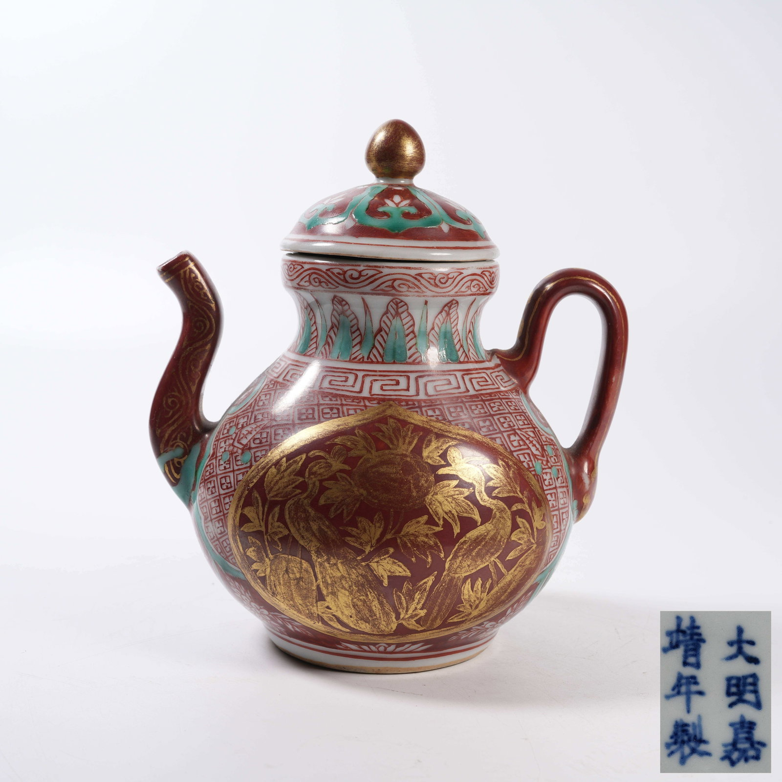 A IRON-RED GILDED EWER WITH AUSPICIOUS FRUIT PATTERN: Iron-Red Gilded Ewer with Auspicious Fruit Pattern