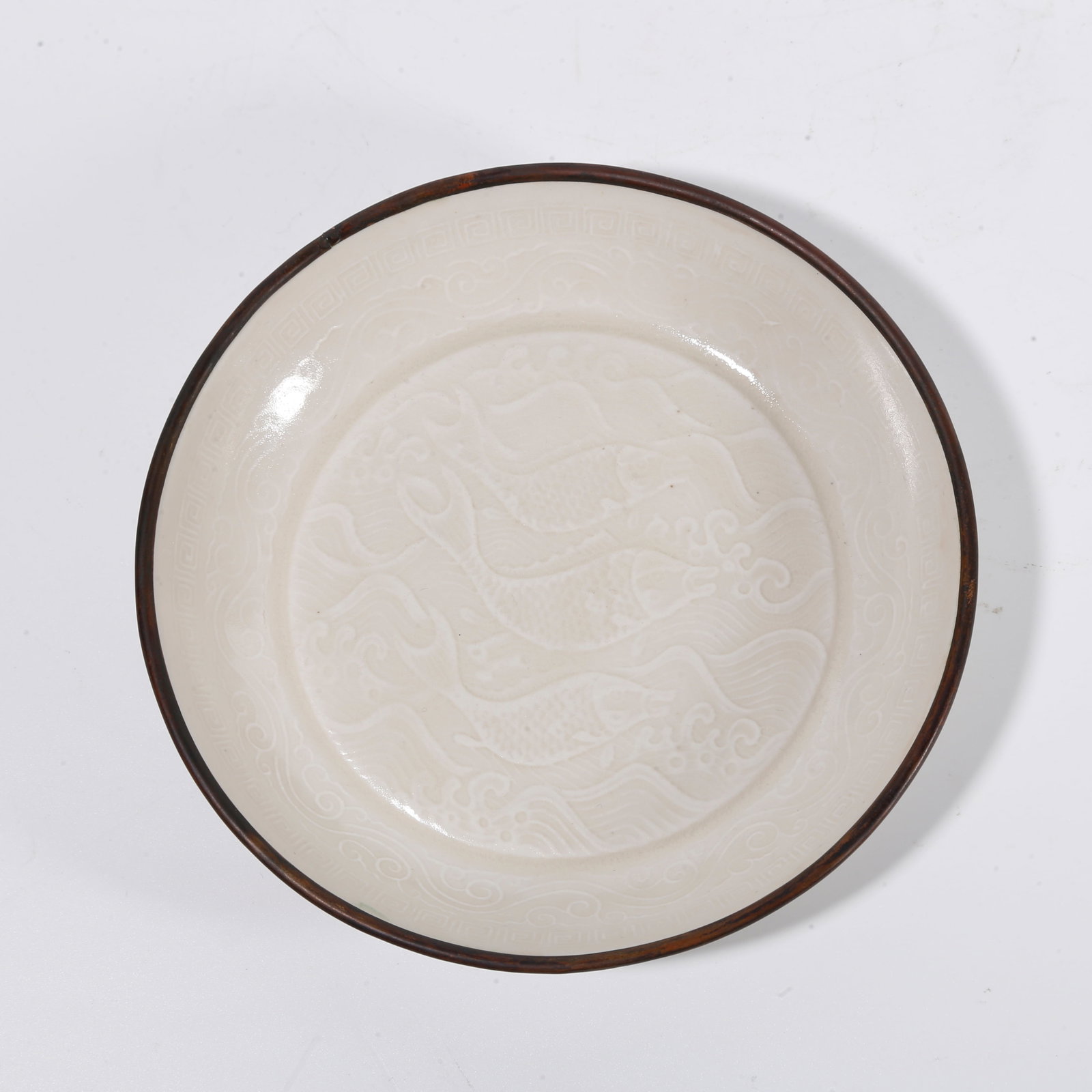 A DING KILN WASHER WITH THREE?FISH MOTIF: Ding kiln washer with three?fish motif