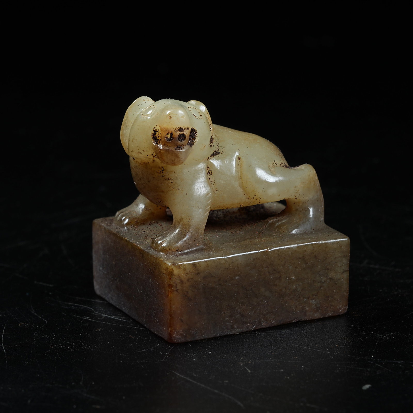 A ANCIENT JADE SEAL WITH BEAR KNOB: Ancient Jade Seal with Bear Knob