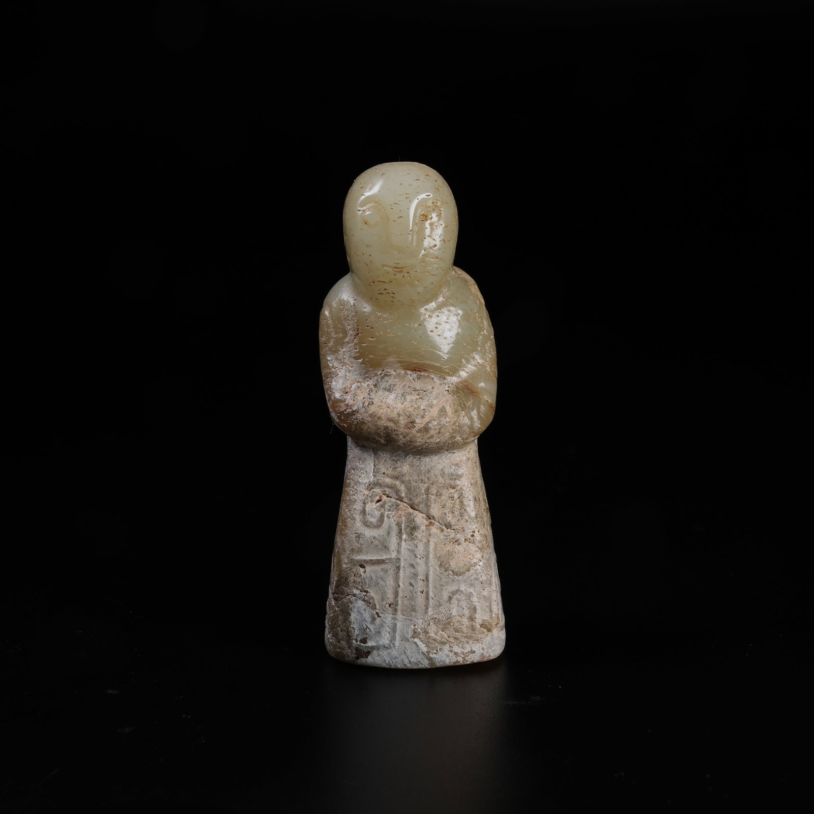 A ARCHAIC JADE DEITY FIGURE (1 of 9)