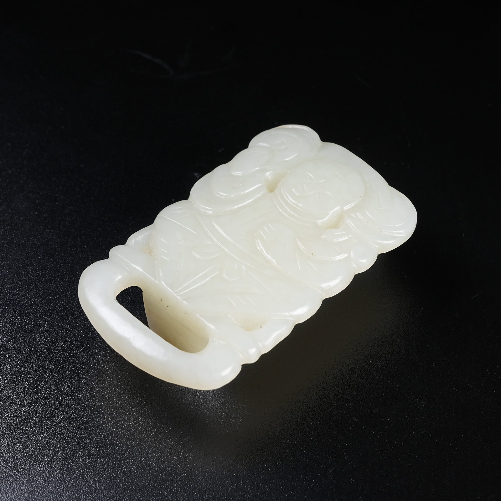 A HETIAN JADE TOGGLE OF WEALTH-DELIVERING BOY (1 of 8)