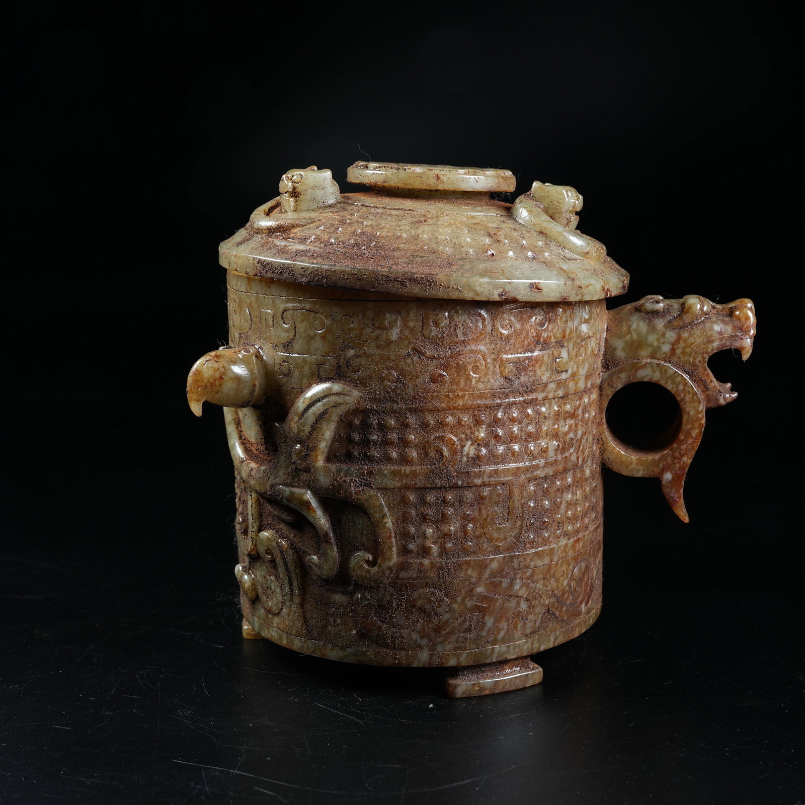 A ANCIENT JADE SLANTED CUP WITH PHOENIX PATTERN: Ancient Jade Slanted Cup with Phoenix Pattern